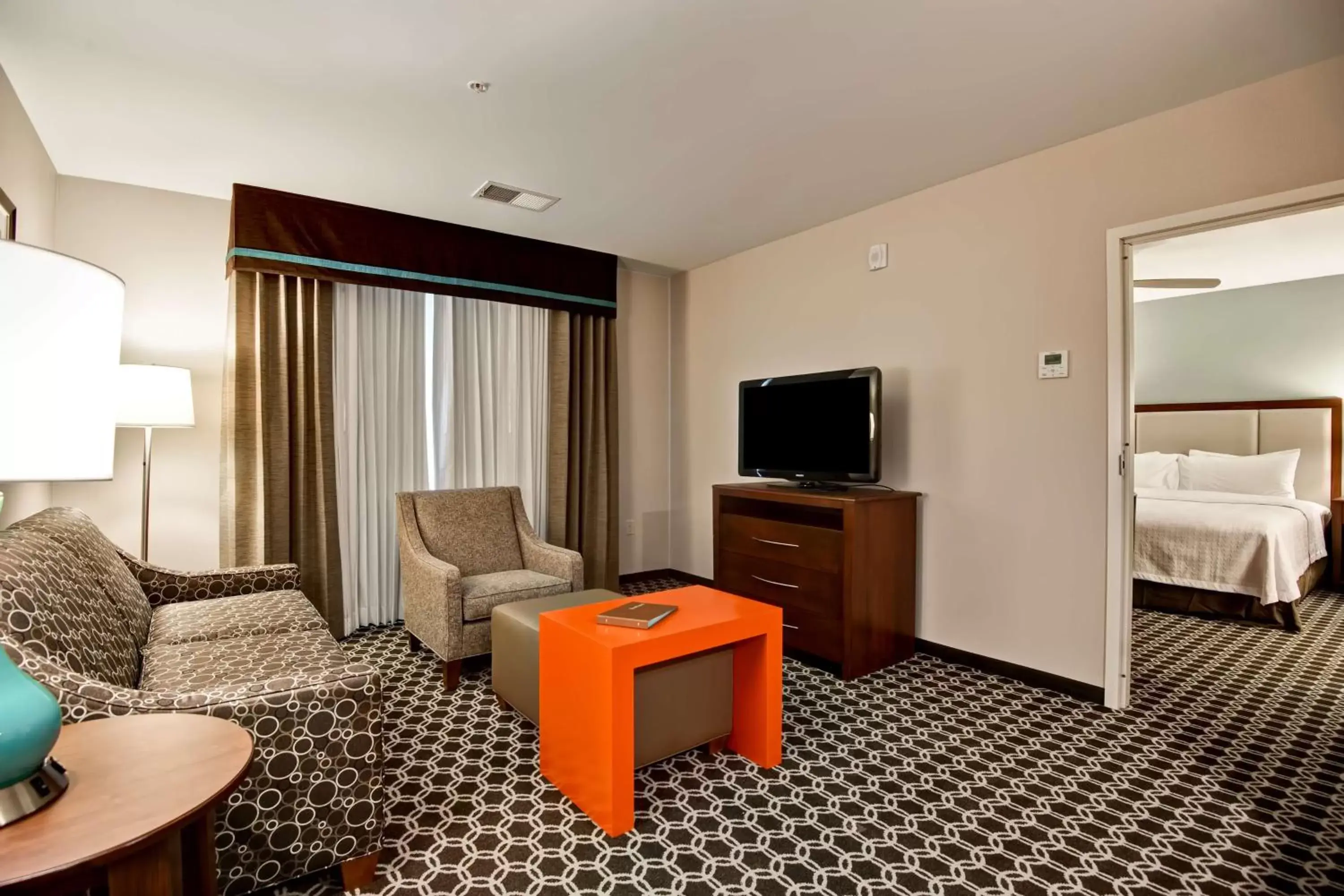Bed, Seating Area in Homewood Suites by Hilton Greeley
