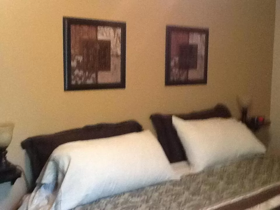 Bed in Vintage Merlot Bed and Breakfast