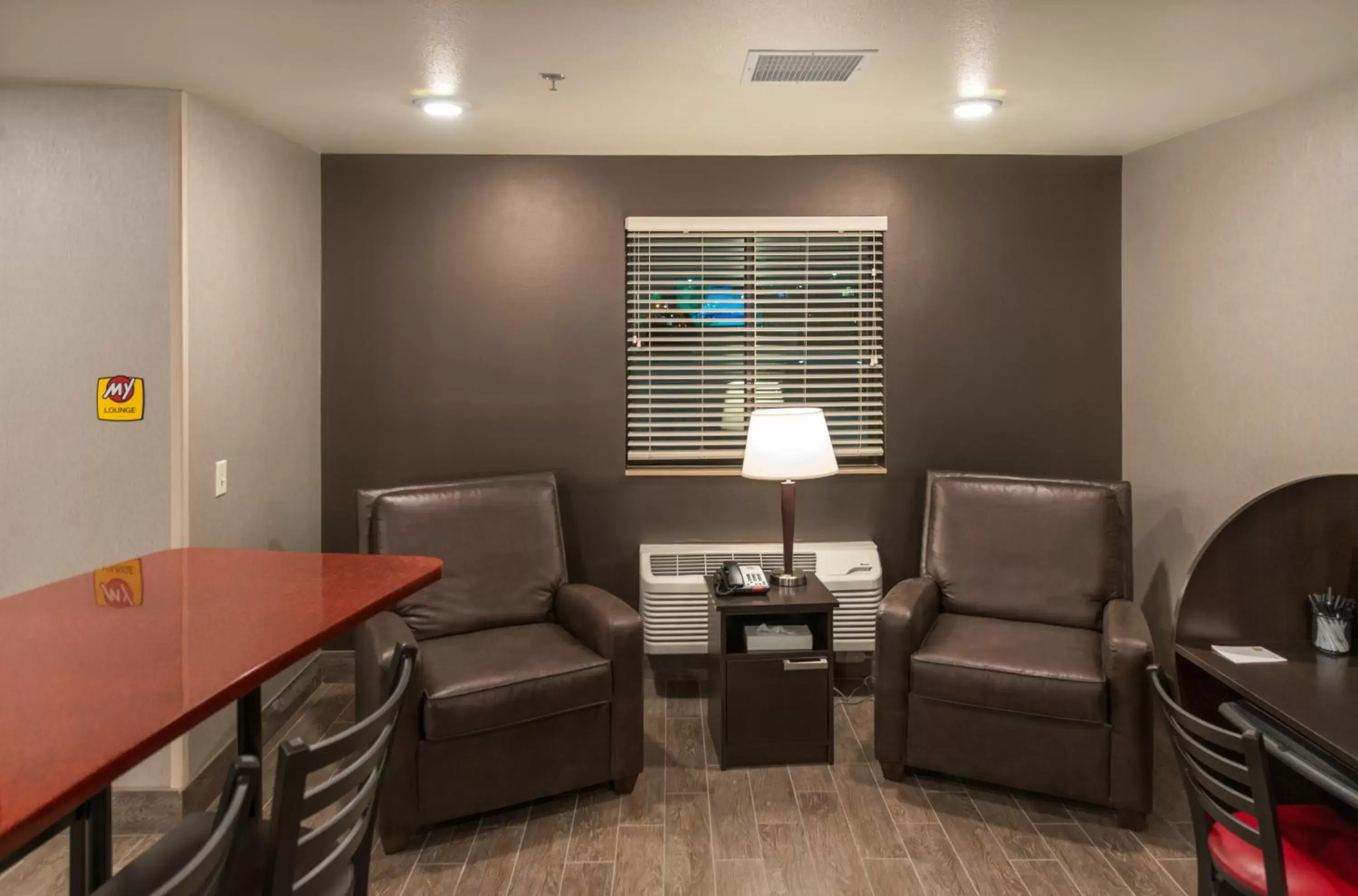 Communal lounge/ TV room, Seating Area in My Place Hotel-Shakopee, MN