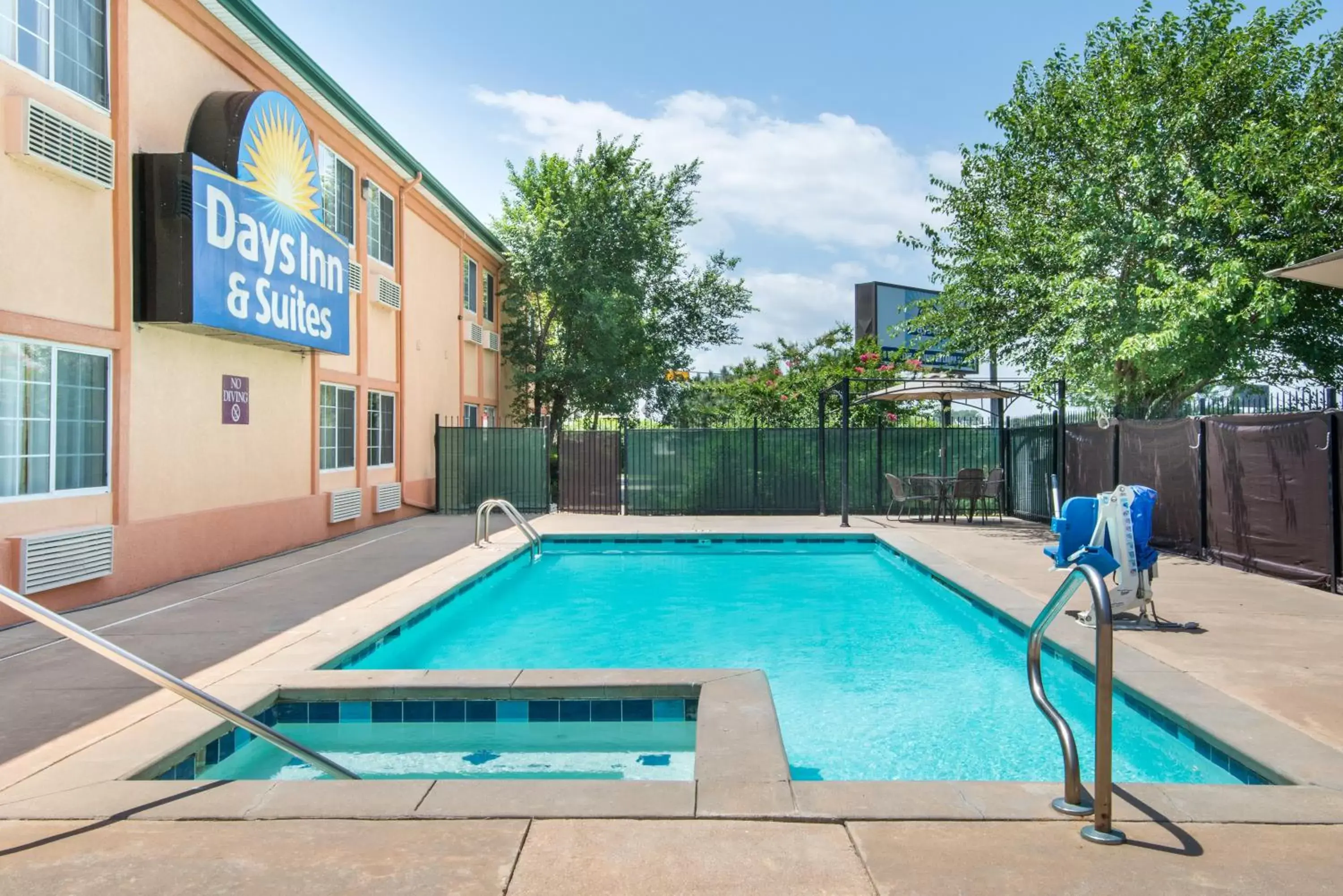 Swimming Pool in Days Inn & Suites by Wyndham Wichita