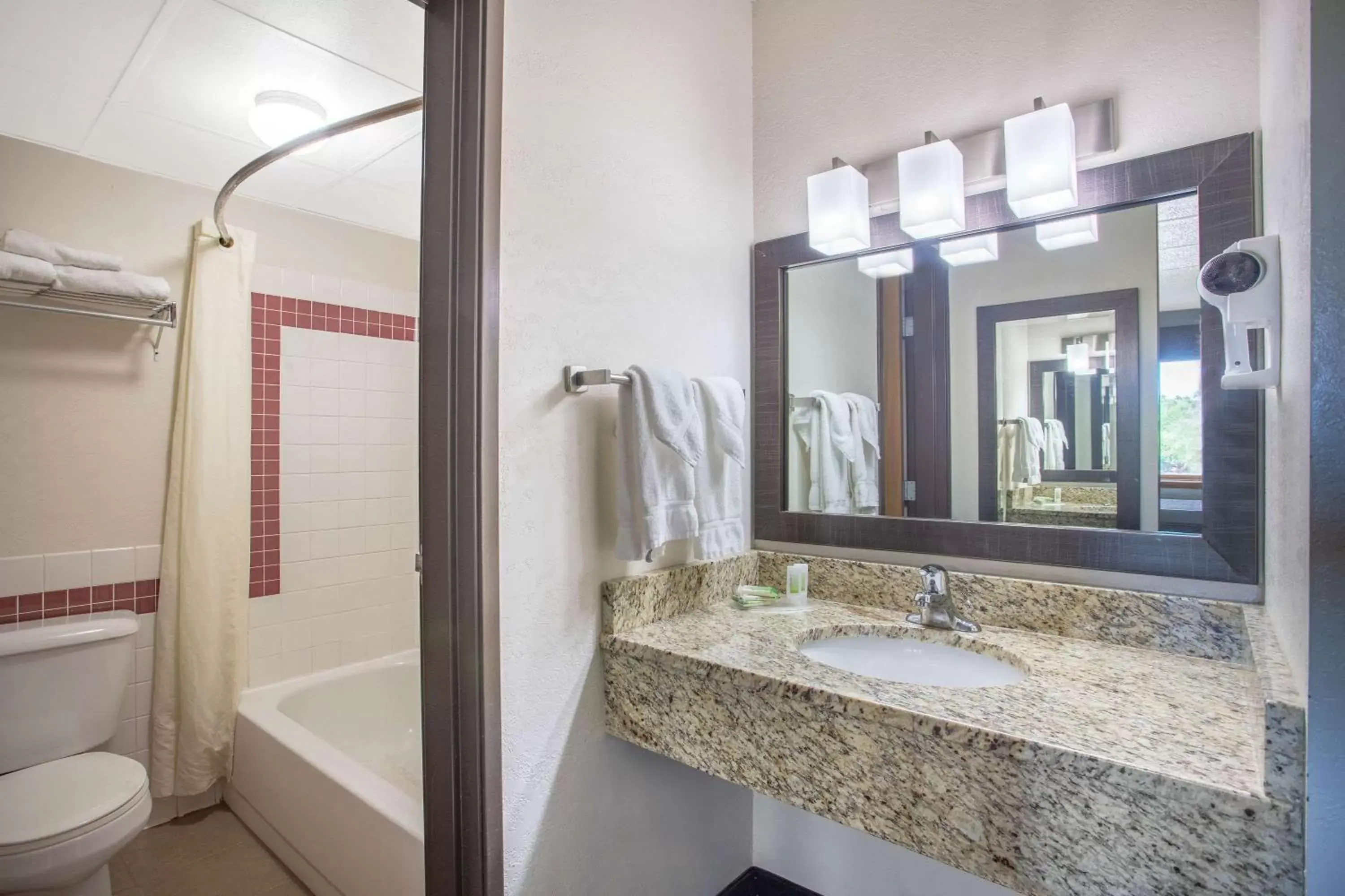 Bathroom in AmericInn by Wyndham Hayward