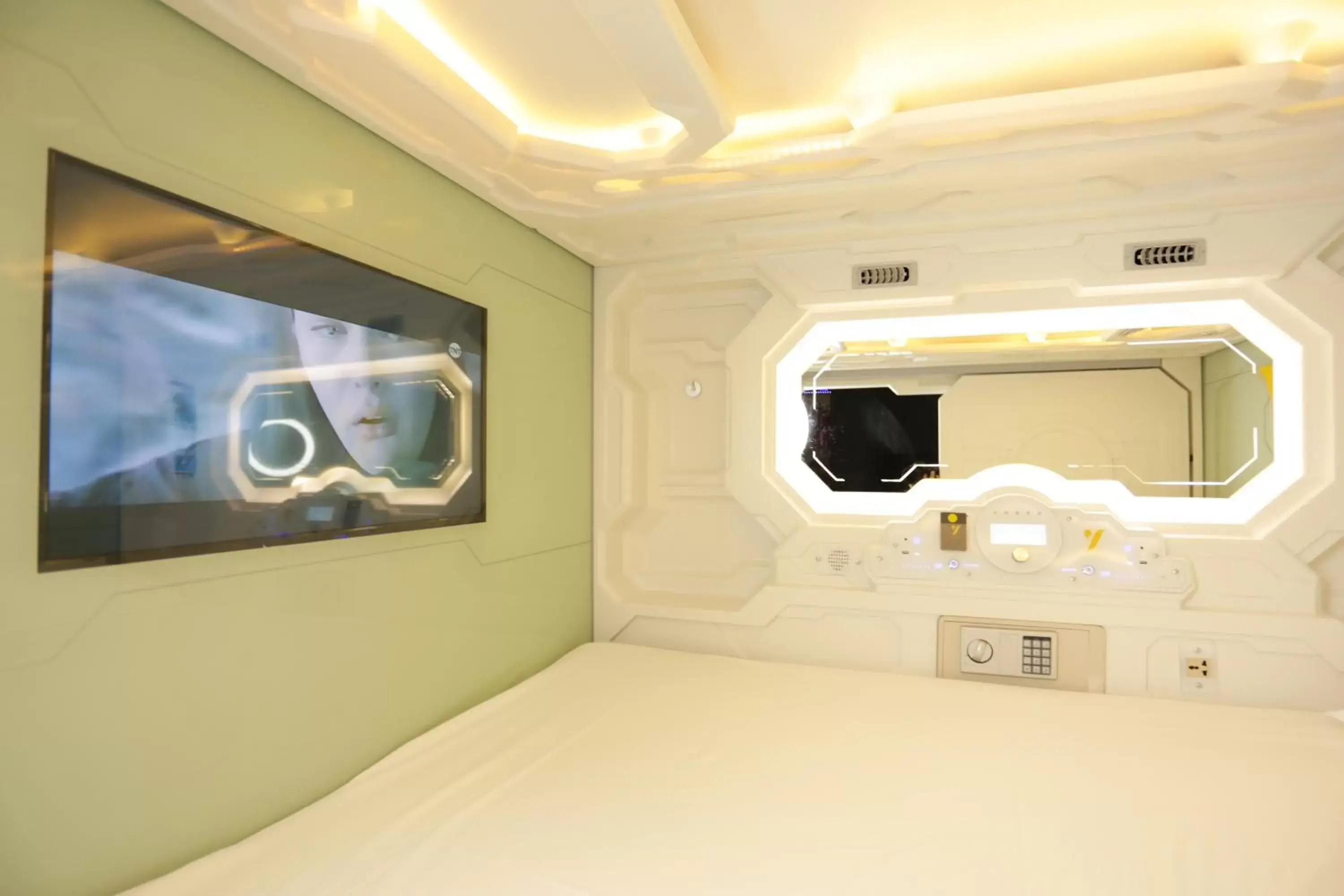 Bed in The Yellow Capsule Experience