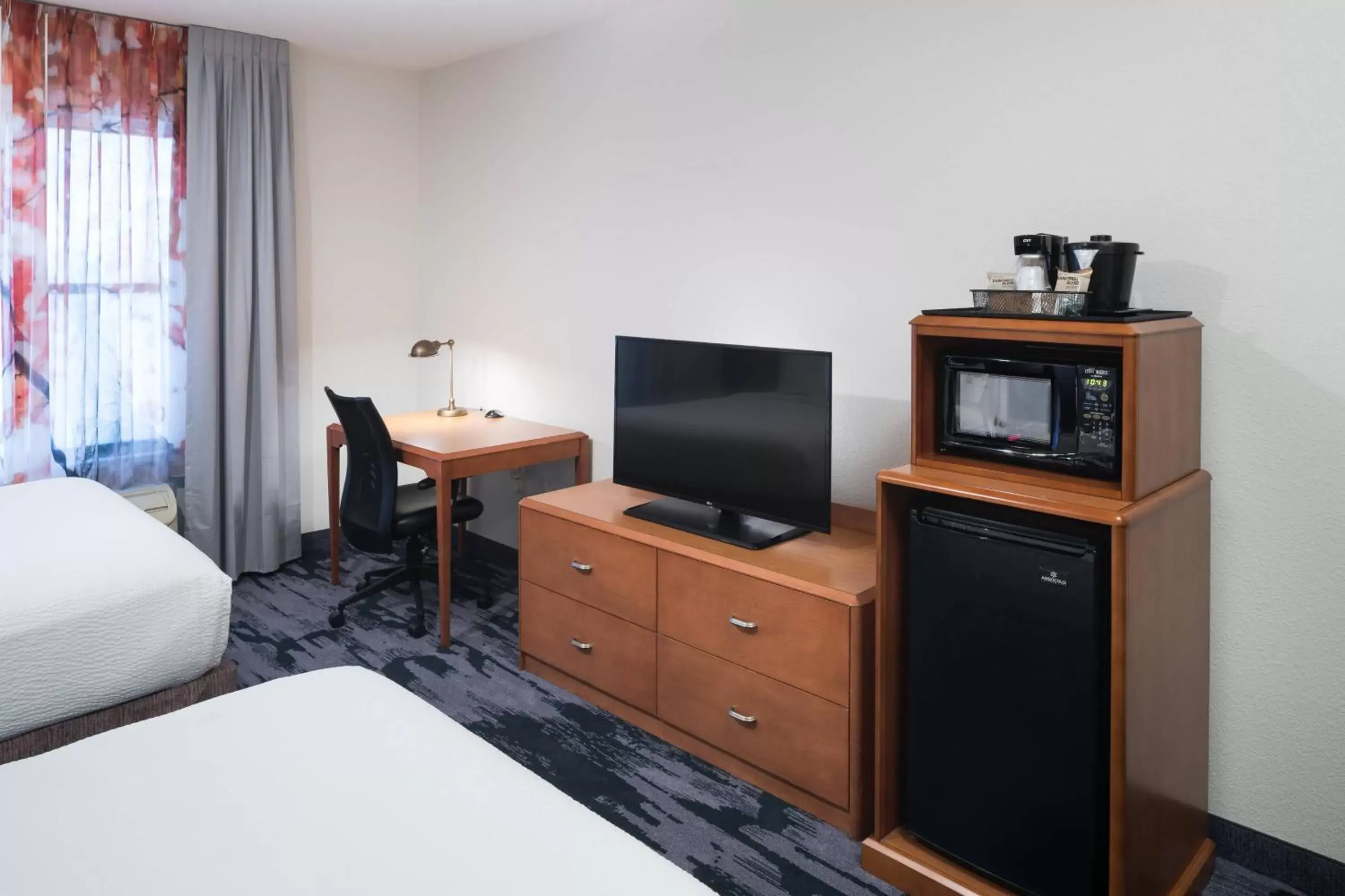 Photo of the whole room, TV/Entertainment Center in Fairfield Inn Suites by Marriott Orlando At SeaWorld