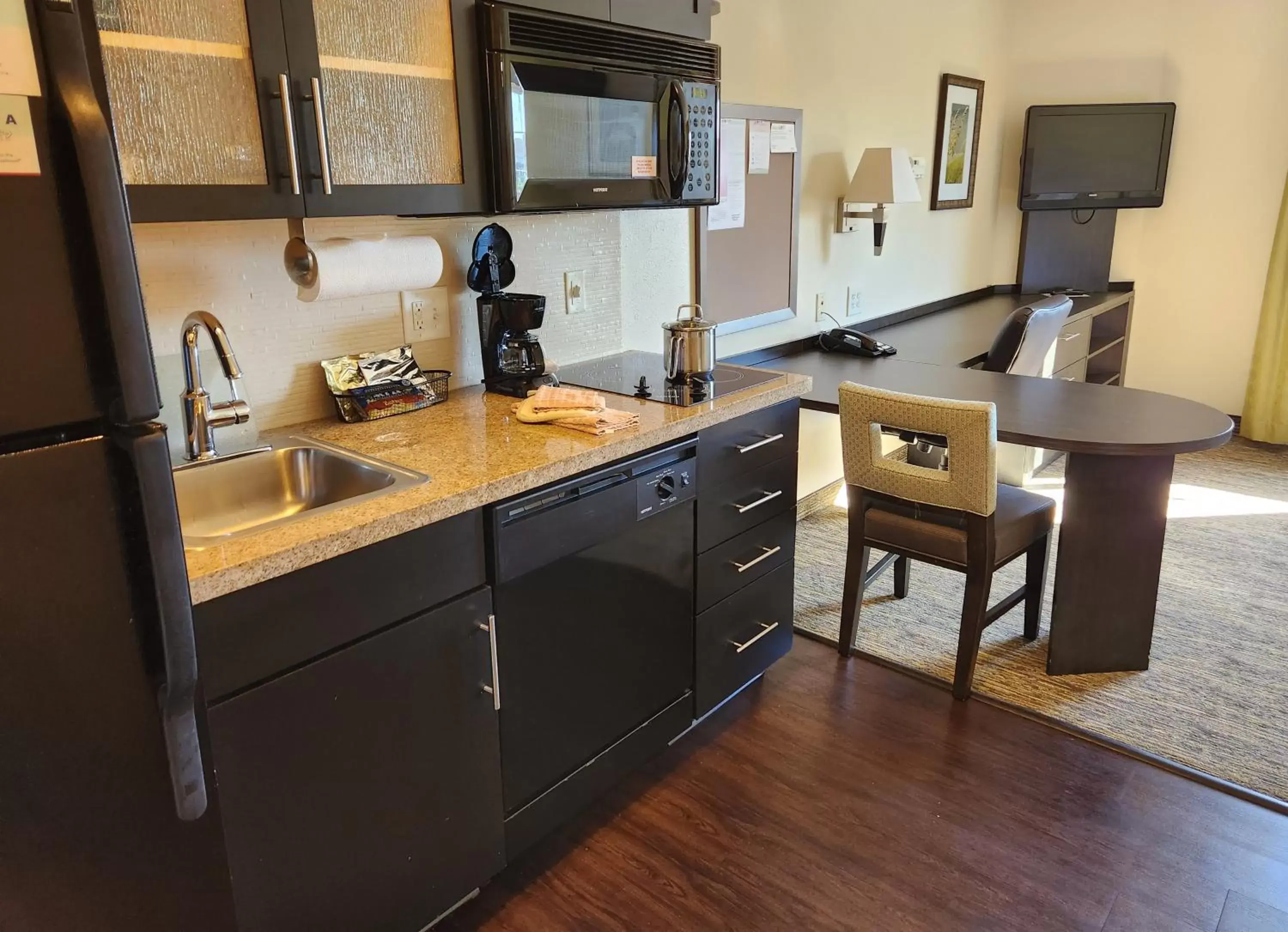 Kitchen or kitchenette, Kitchen/Kitchenette in Candlewood Suites Greenville NC, an IHG Hotel