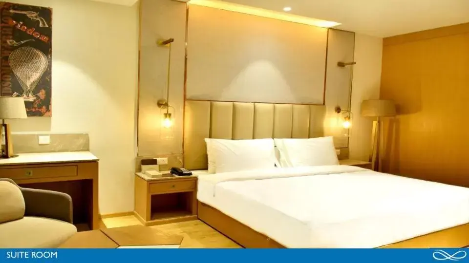 Bed in Sarovar Portico Morbi