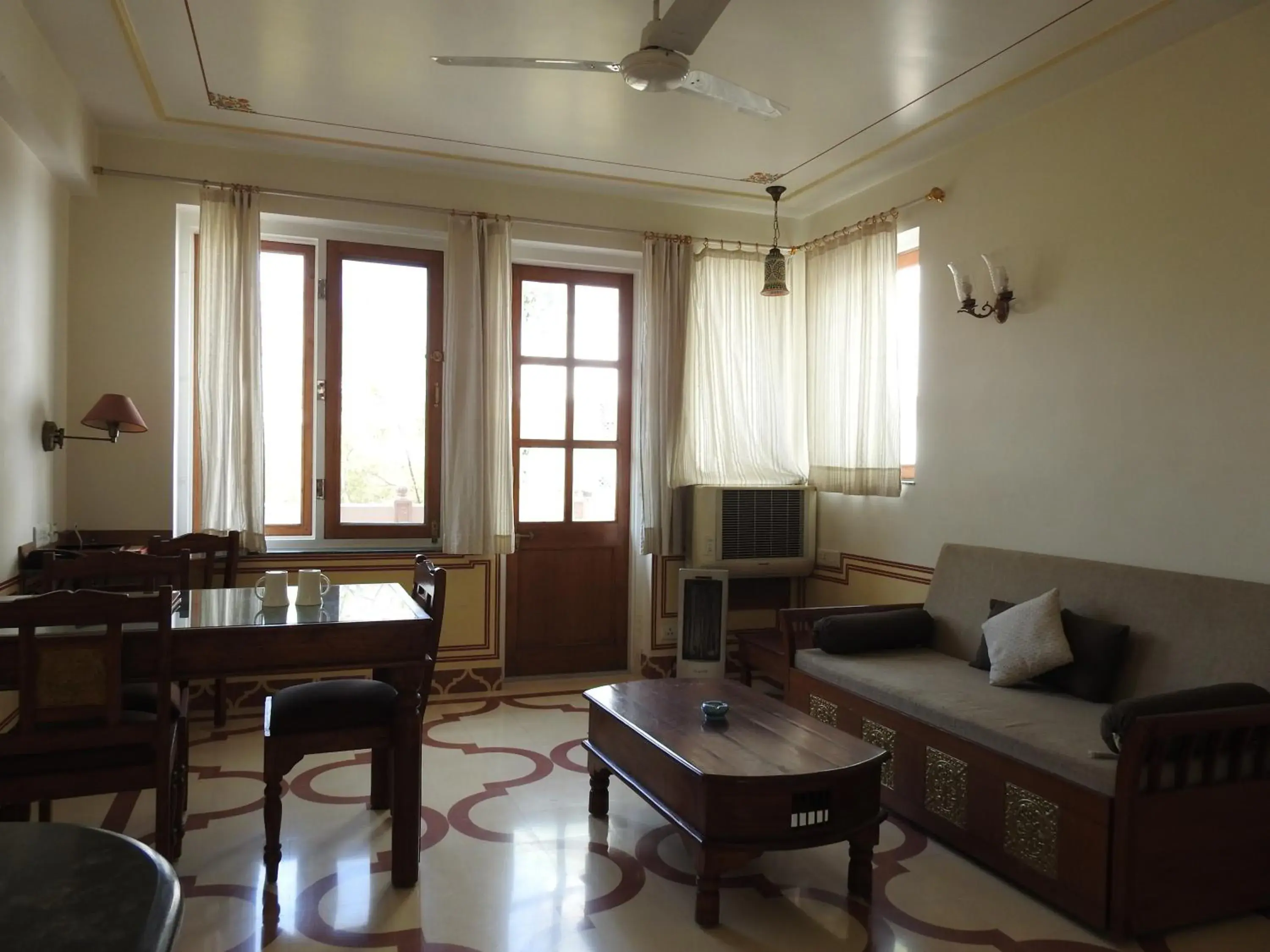 Bedroom, Seating Area in Om Niwas Suite Hotel