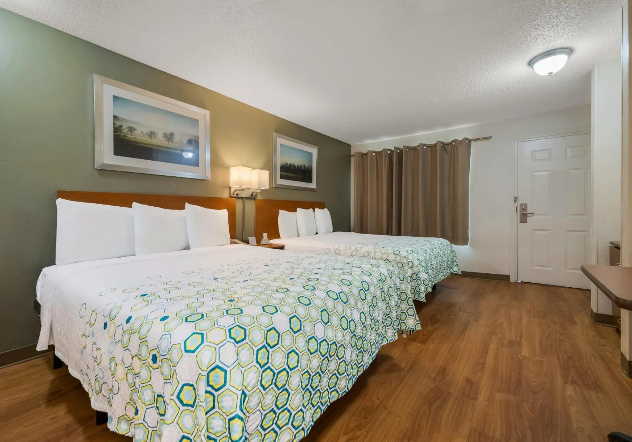 Bedroom, Bed in HomeTowne Studios by Red Roof Orlando - UCF Area