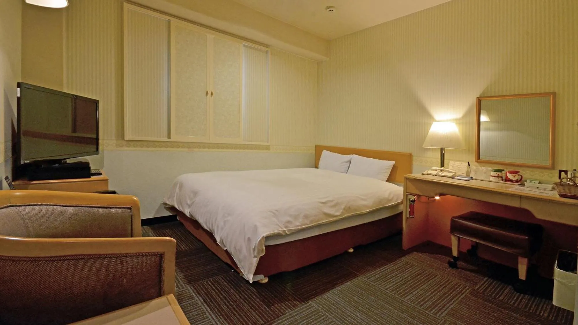 Photo of the whole room, Bed in Omura Central Hotel