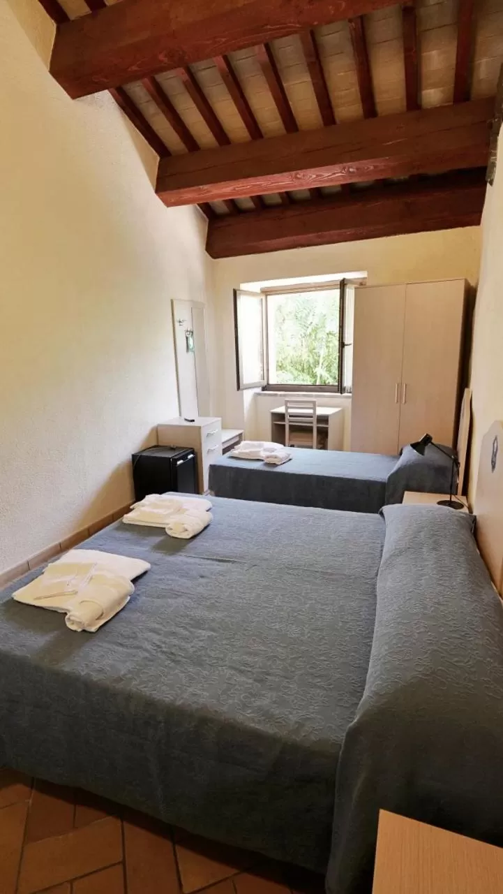 Bed in Borgo de' Varano by Hotel I Duchi