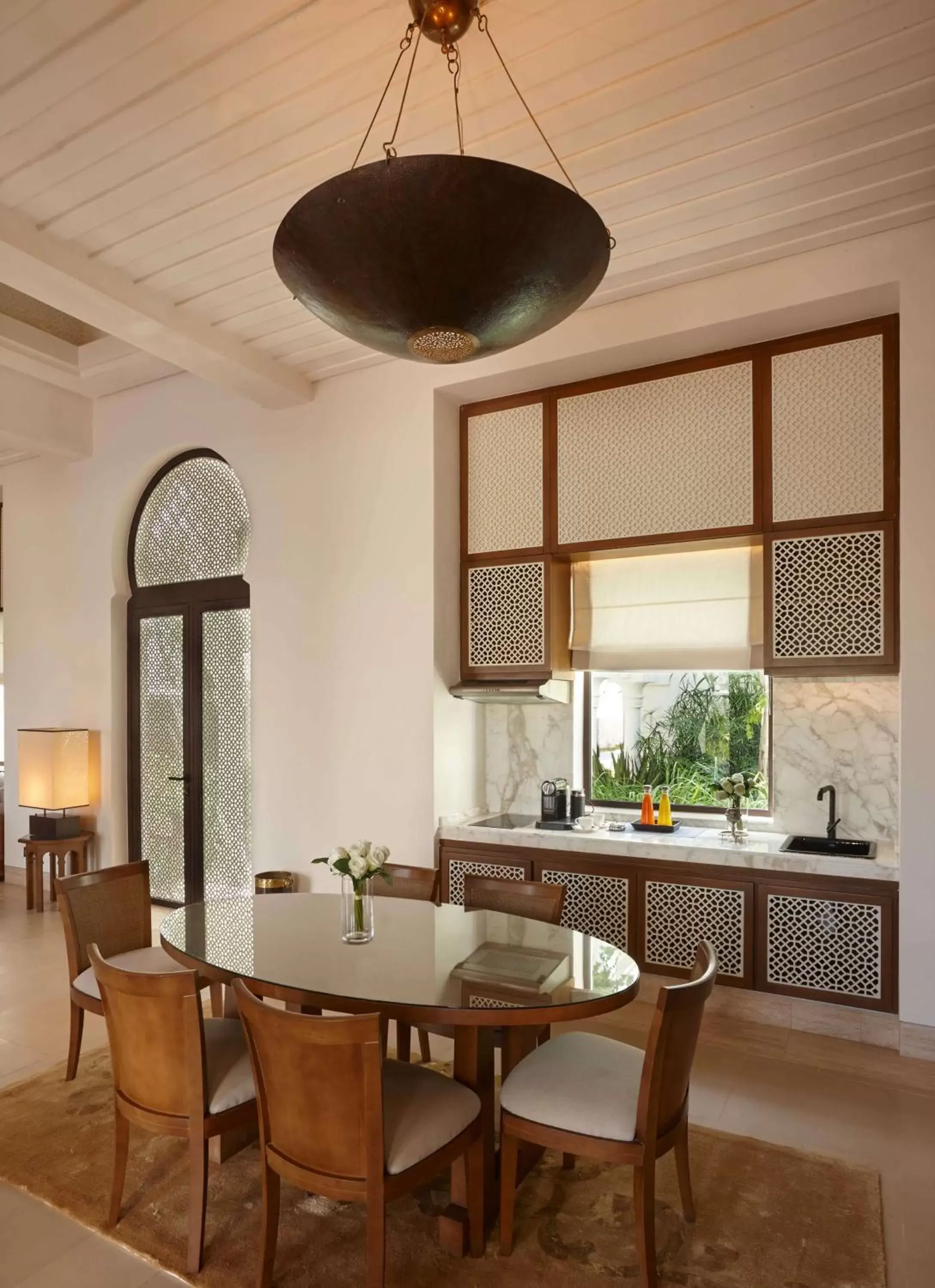 Kitchen or kitchenette, Dining Area in Banyan Tree Tamouda Bay