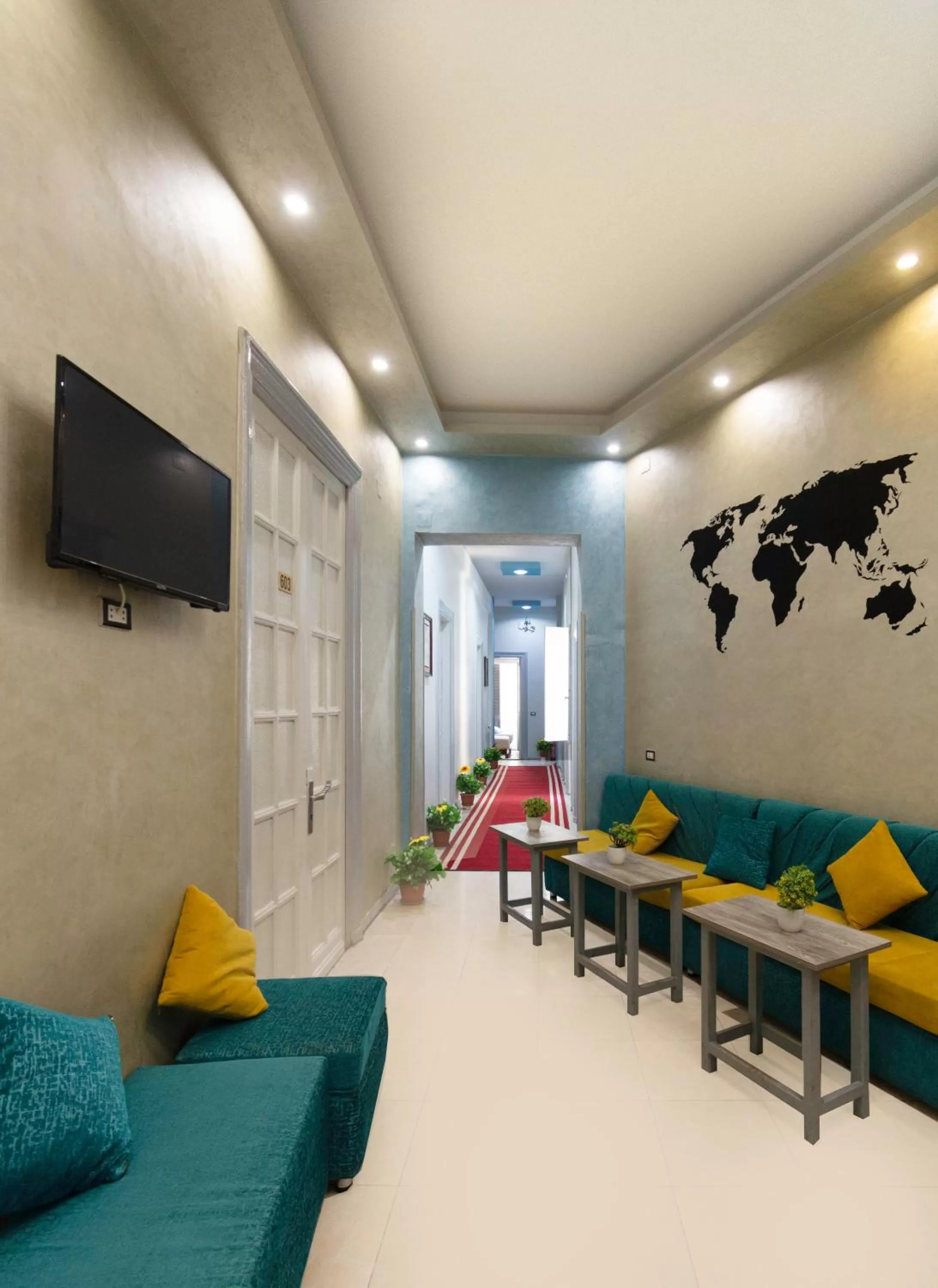 Communal lounge/ TV room in Minerva Grand Boutique