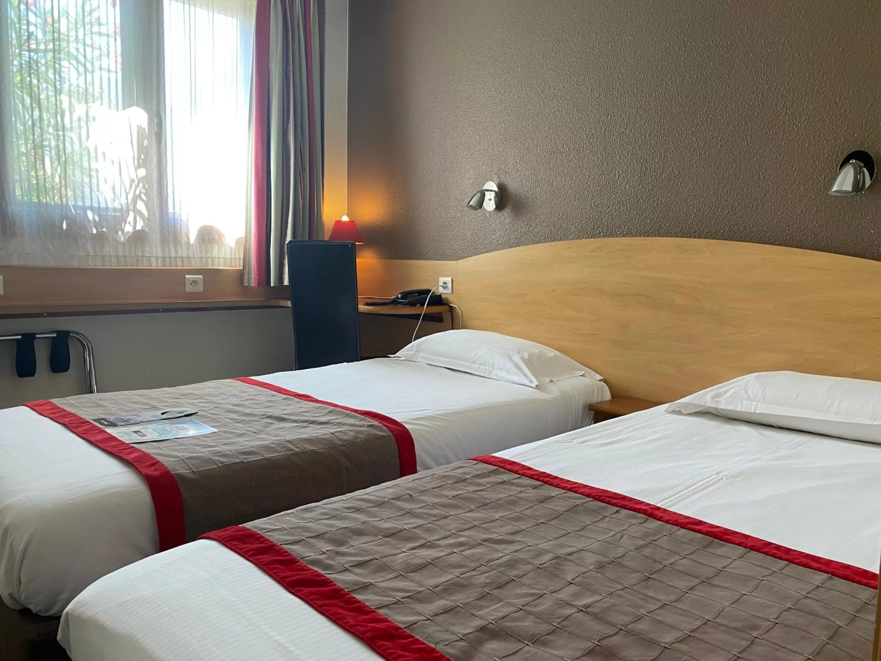 Photo of the whole room, Bed in Kyriad Montpellier Aéroport - Gare Sud de France