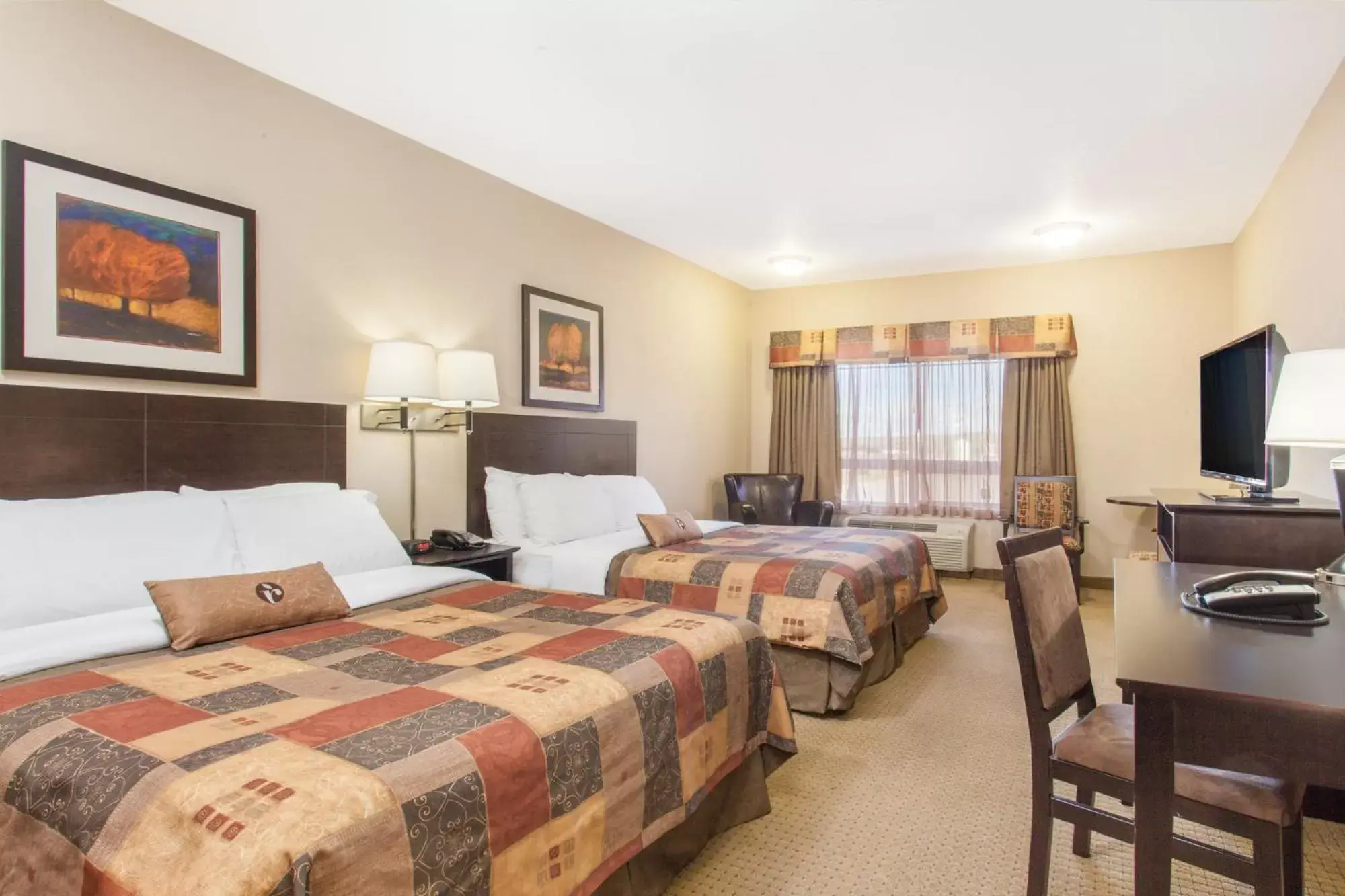 Bed in Ramada by Wyndham Pincher Creek