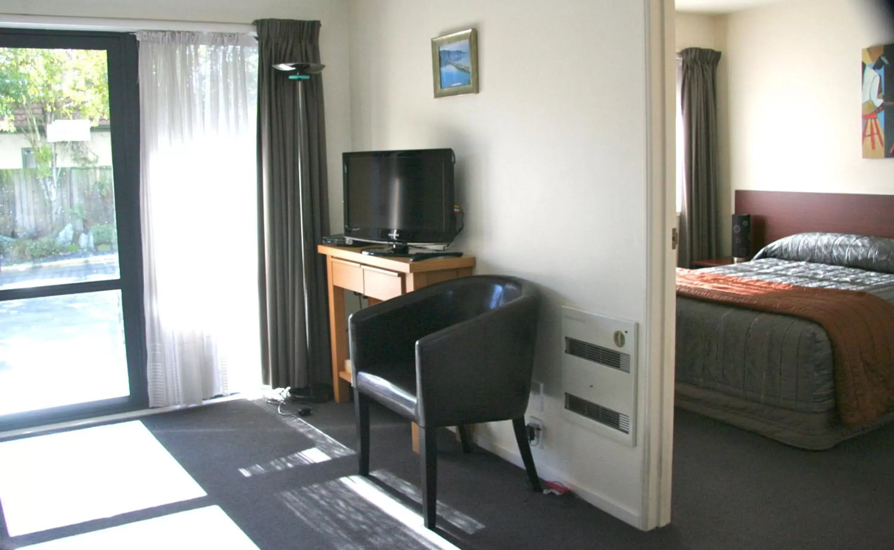 Day, TV/Entertainment Center in Sherborne Motor Lodge