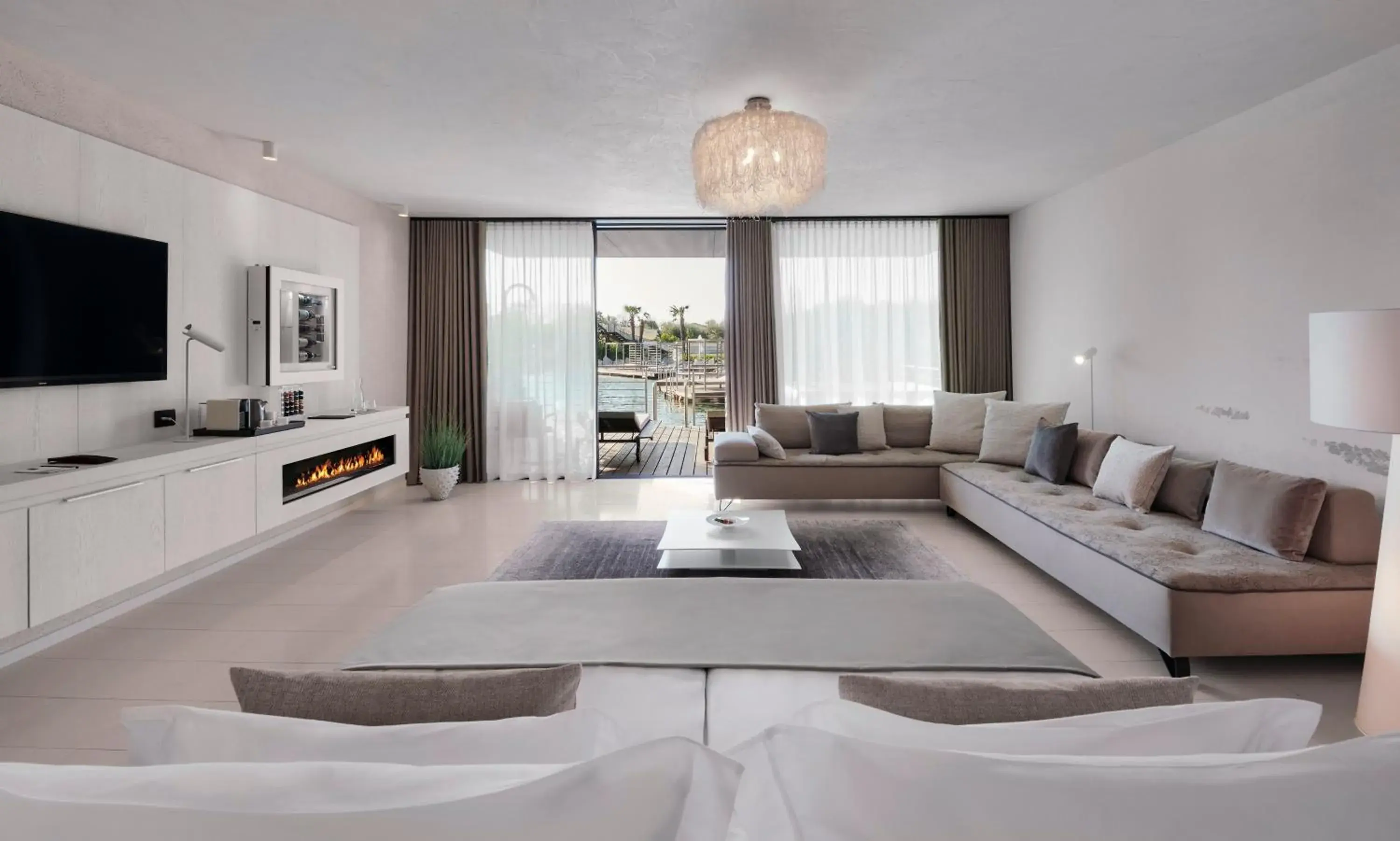 Bed, Seating Area in Quellenhof Luxury Resort Lazise