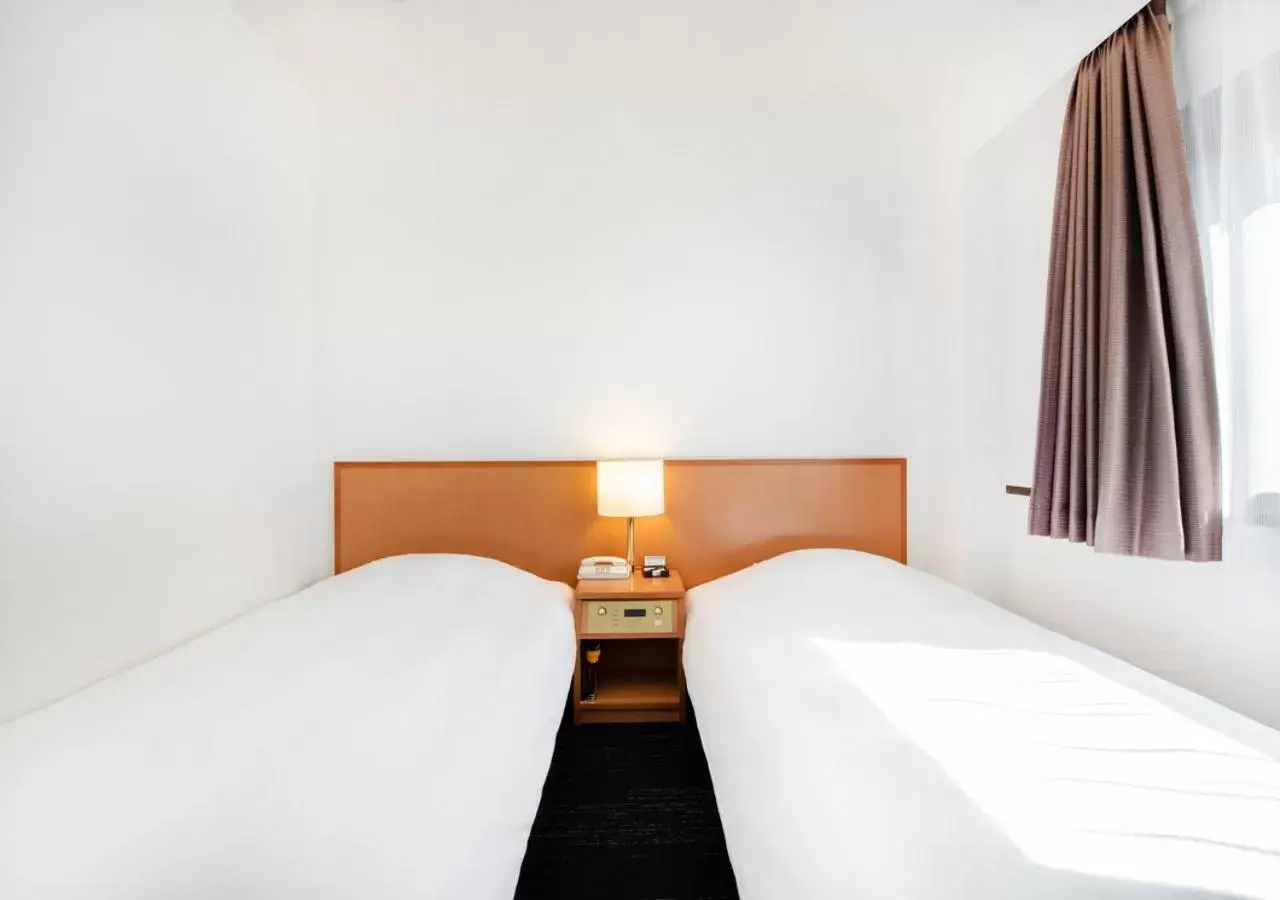 Bed in TKP Sunlife Hotel