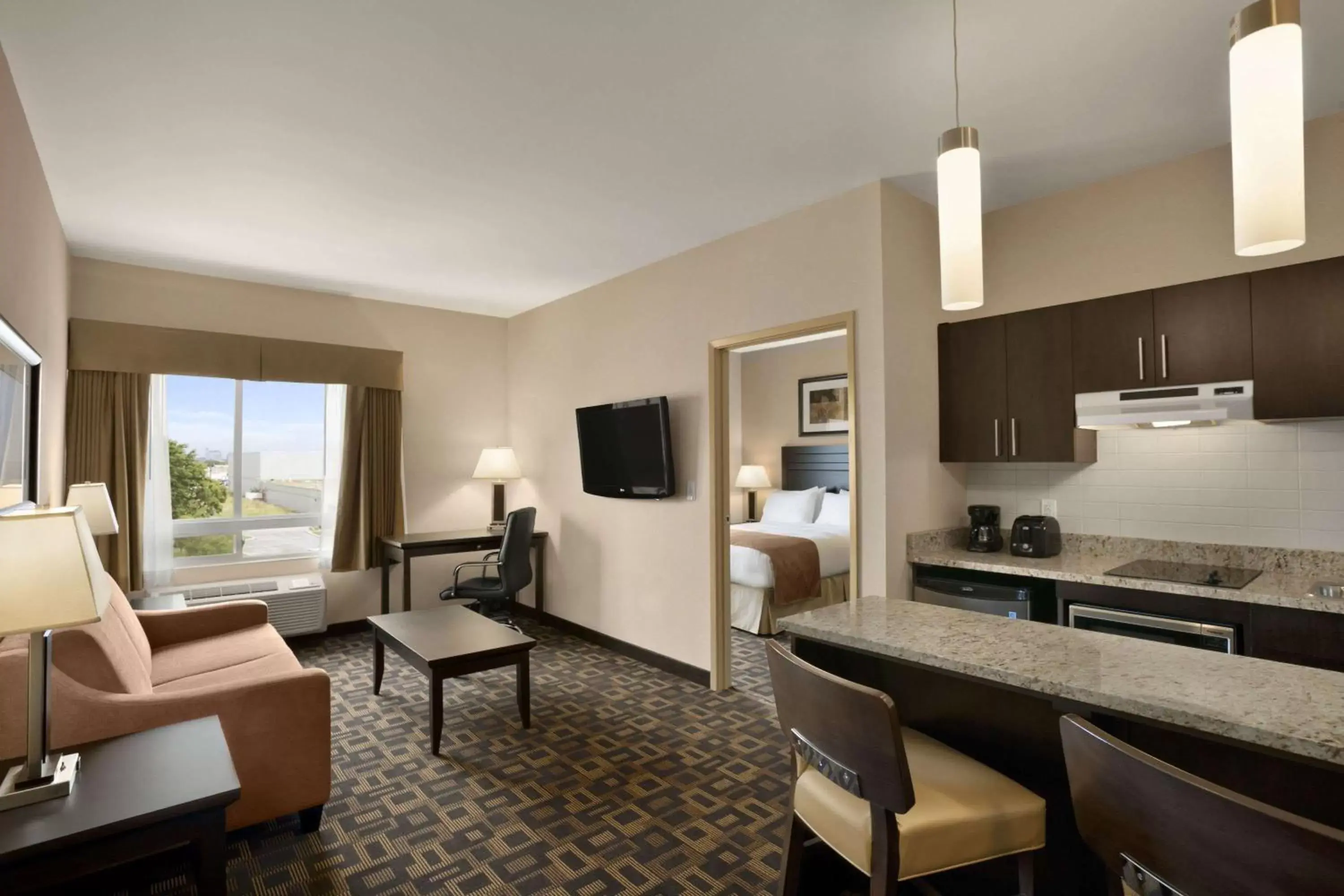 Photo of the whole room, Kitchen/Kitchenette in Days Inn & Suites by Wyndham Winnipeg Airport Manitoba