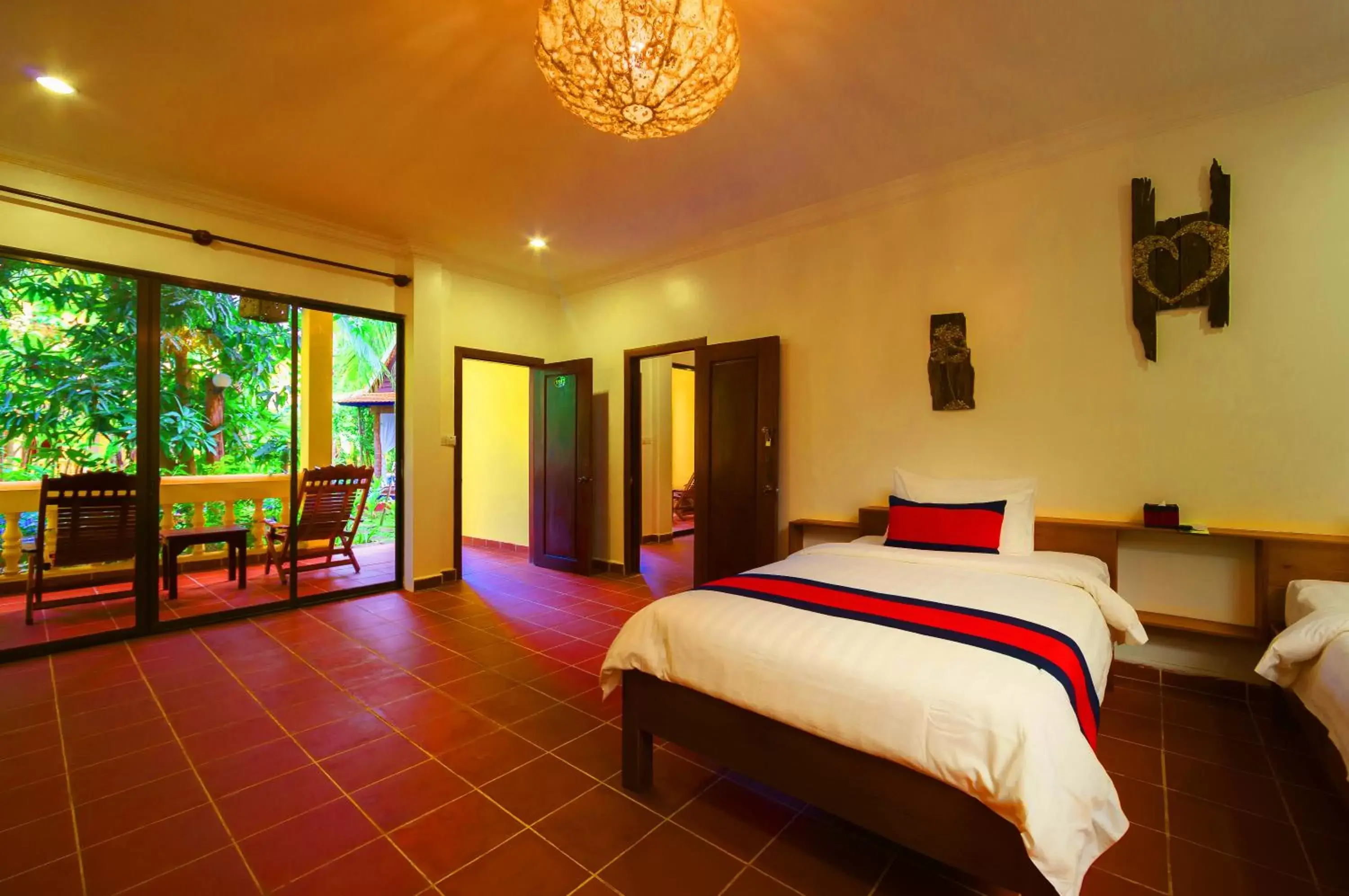 Bedroom in Le Jardin d'Angkor Hotel & Resort