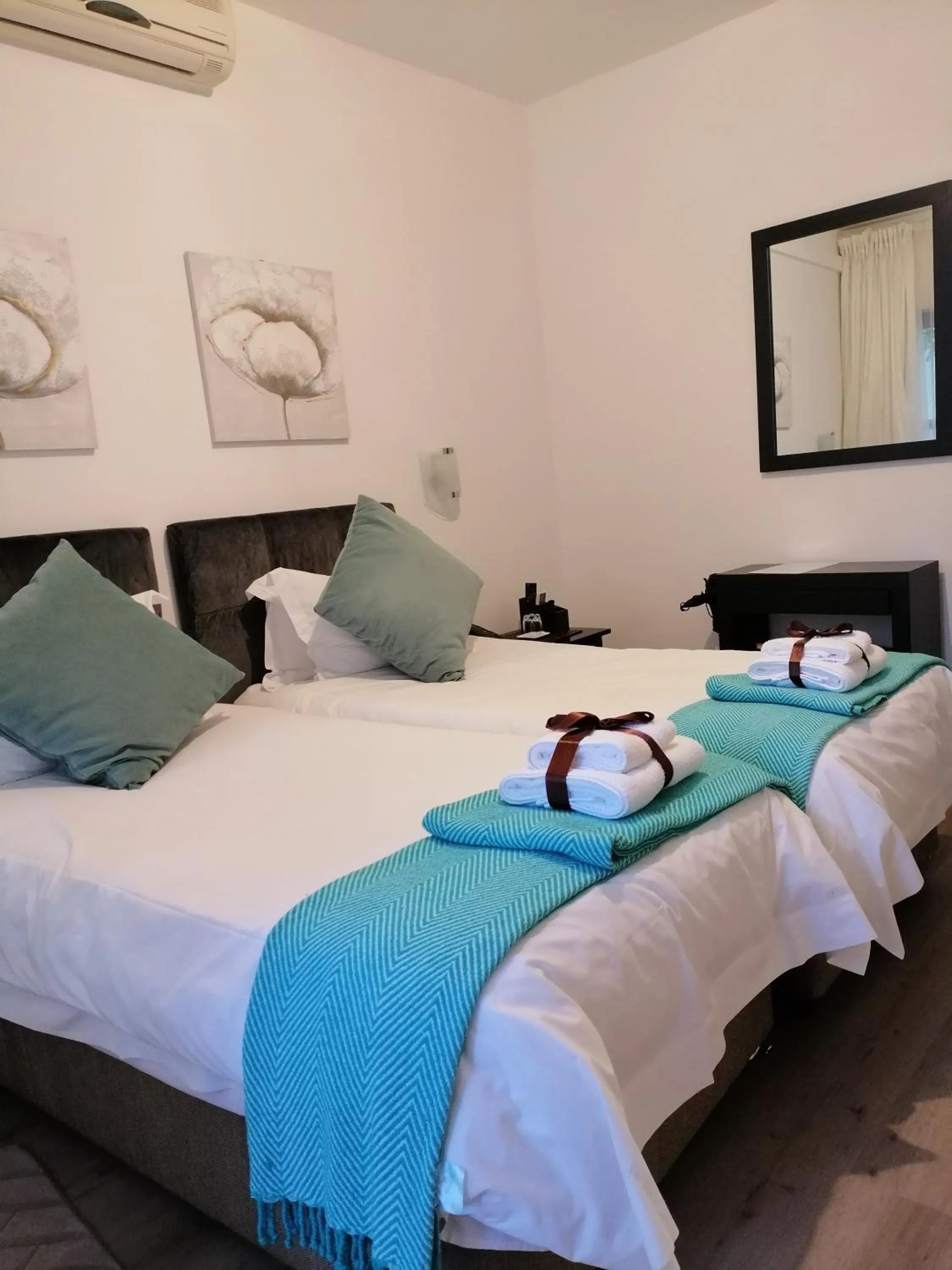 Bed in Point B Guest House -Sustainable Solar Energy