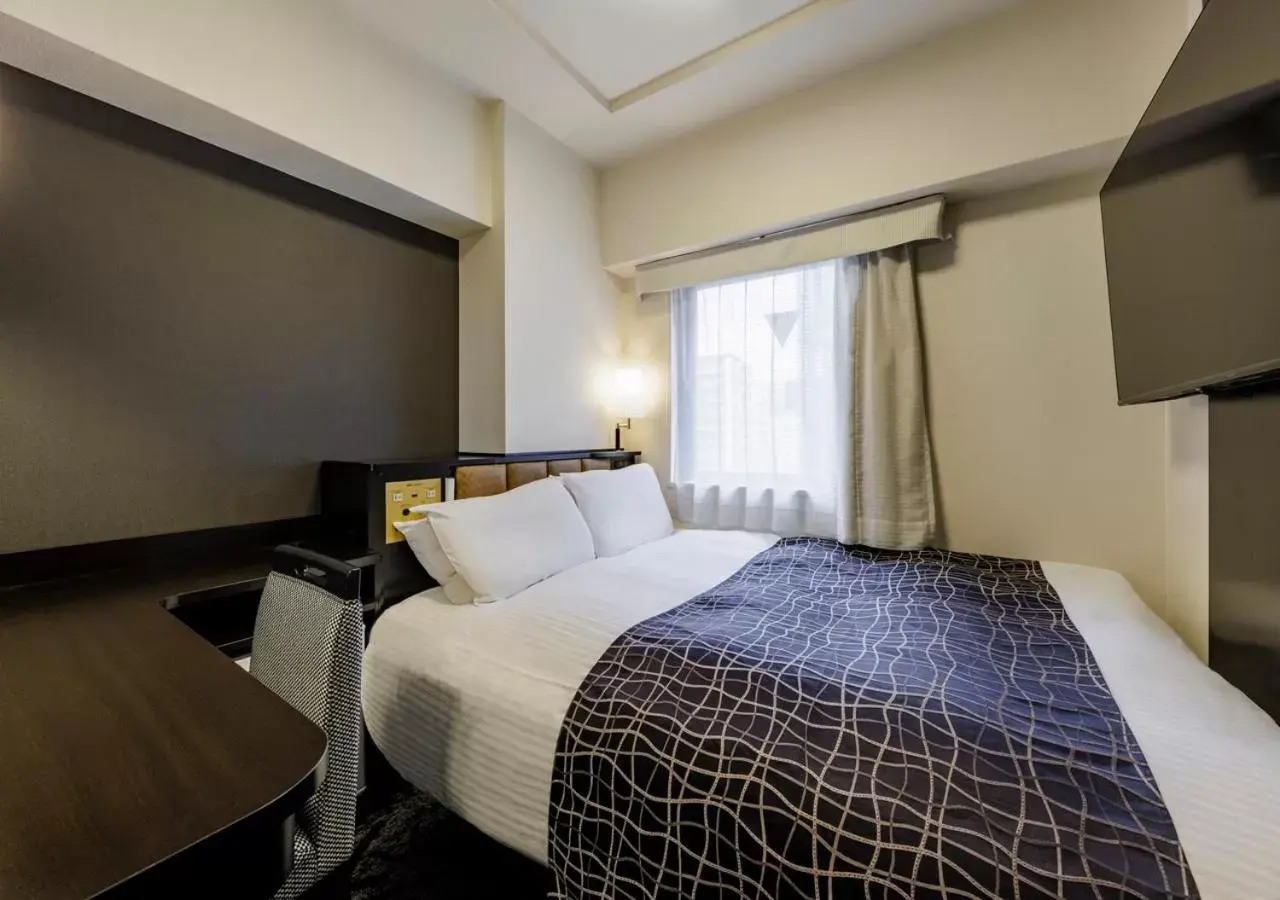 Bed in APA Hotel Hakata Ekimae 4 chome