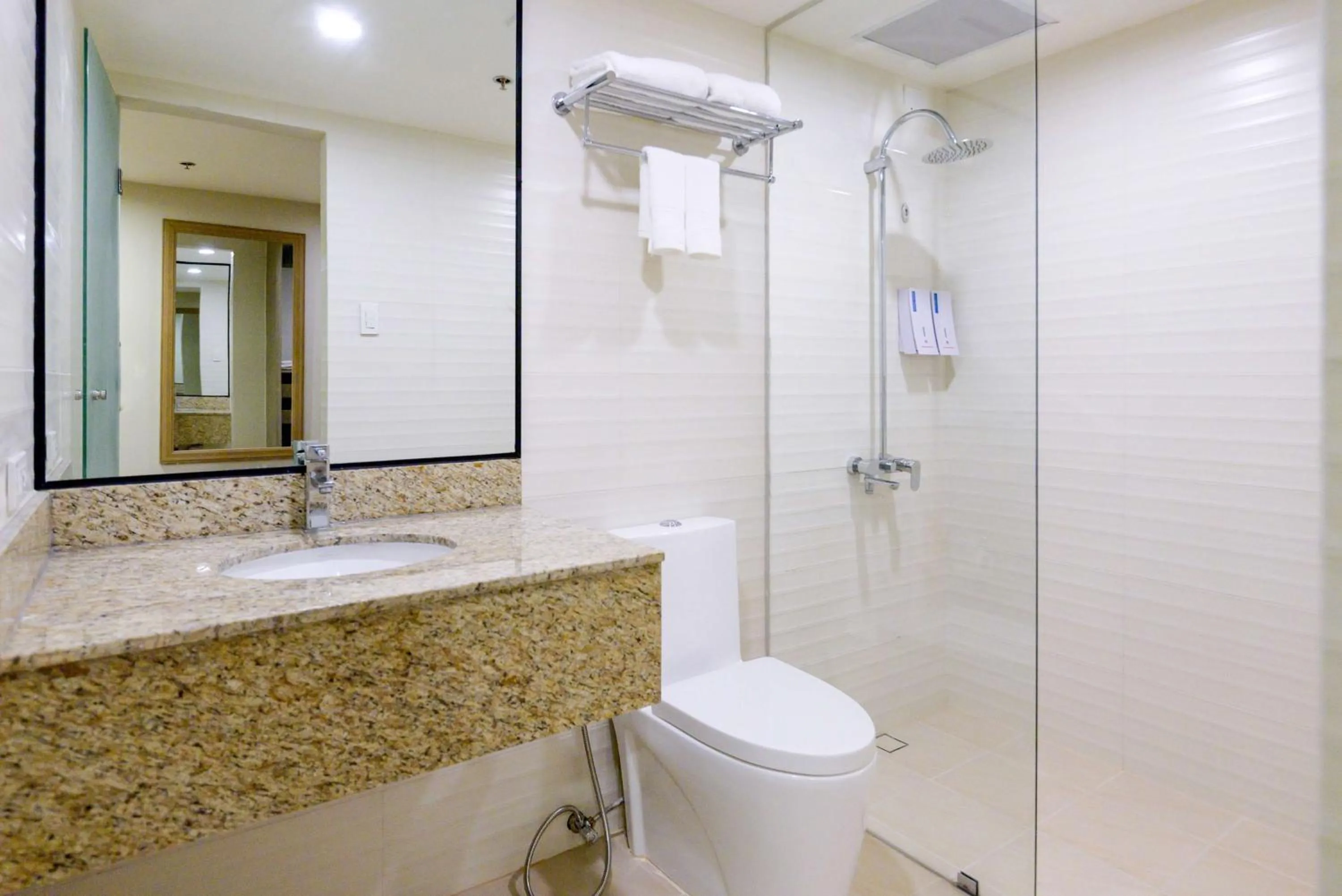 Bathroom in SureStay Plus by Best Western Cebu City