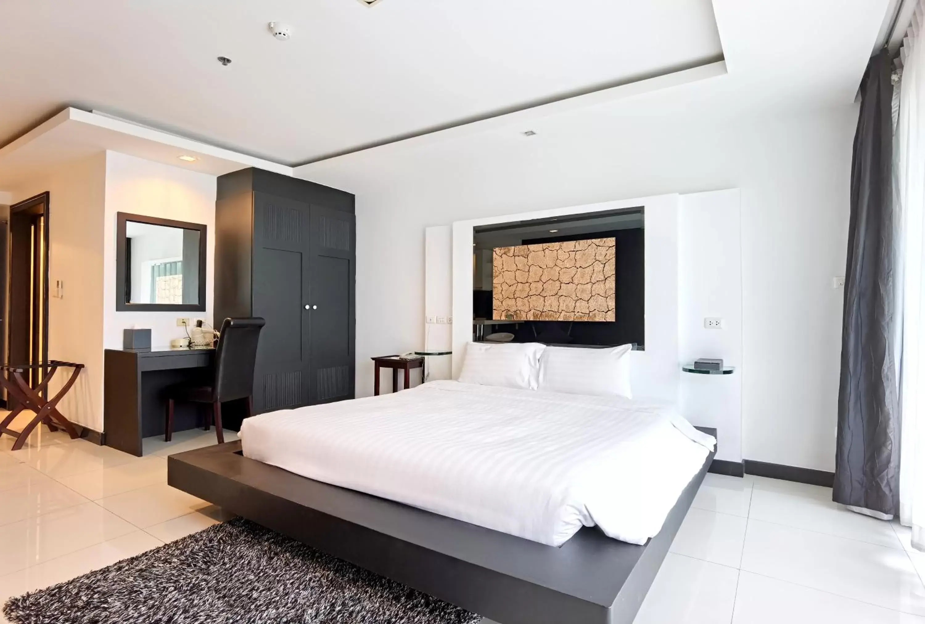 Bed in Nova Suites Pattaya by Compass Hospitality