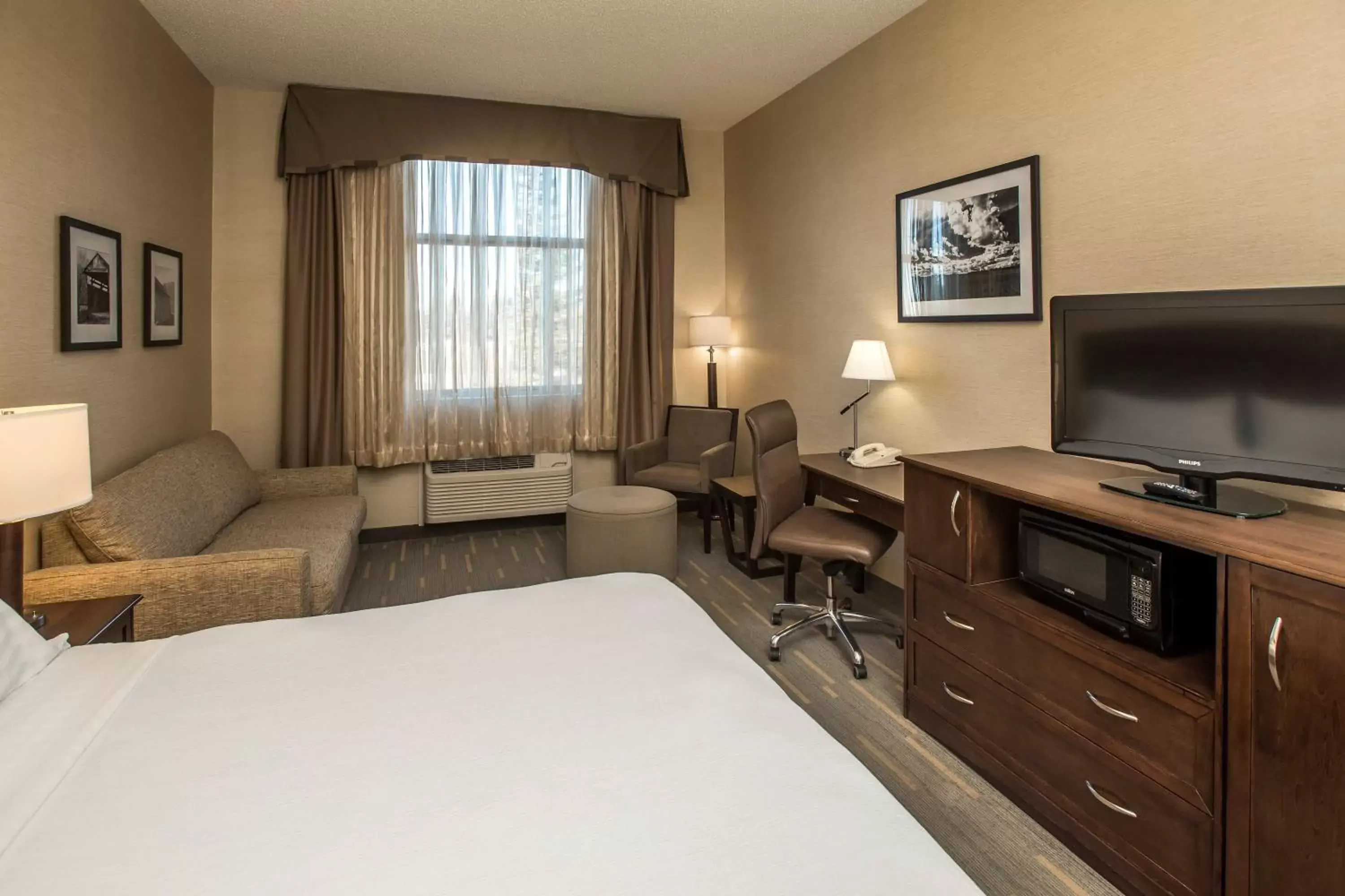 Photo of the whole room, TV/Entertainment Center in Holiday Inn Lethbridge, an IHG Hotel