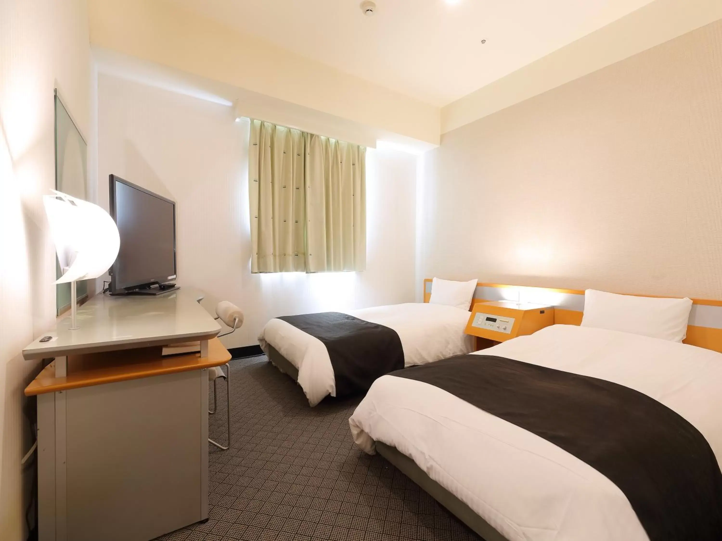 Bed in APA Hotel Toyama-Ekimae
