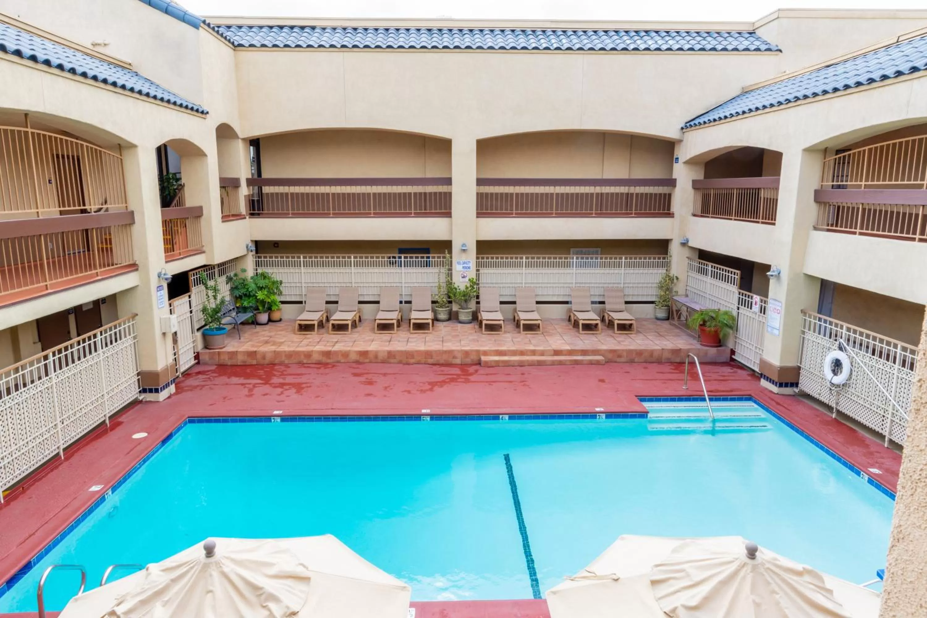 Swimming pool in Days Inn & Suites by Wyndham Artesia