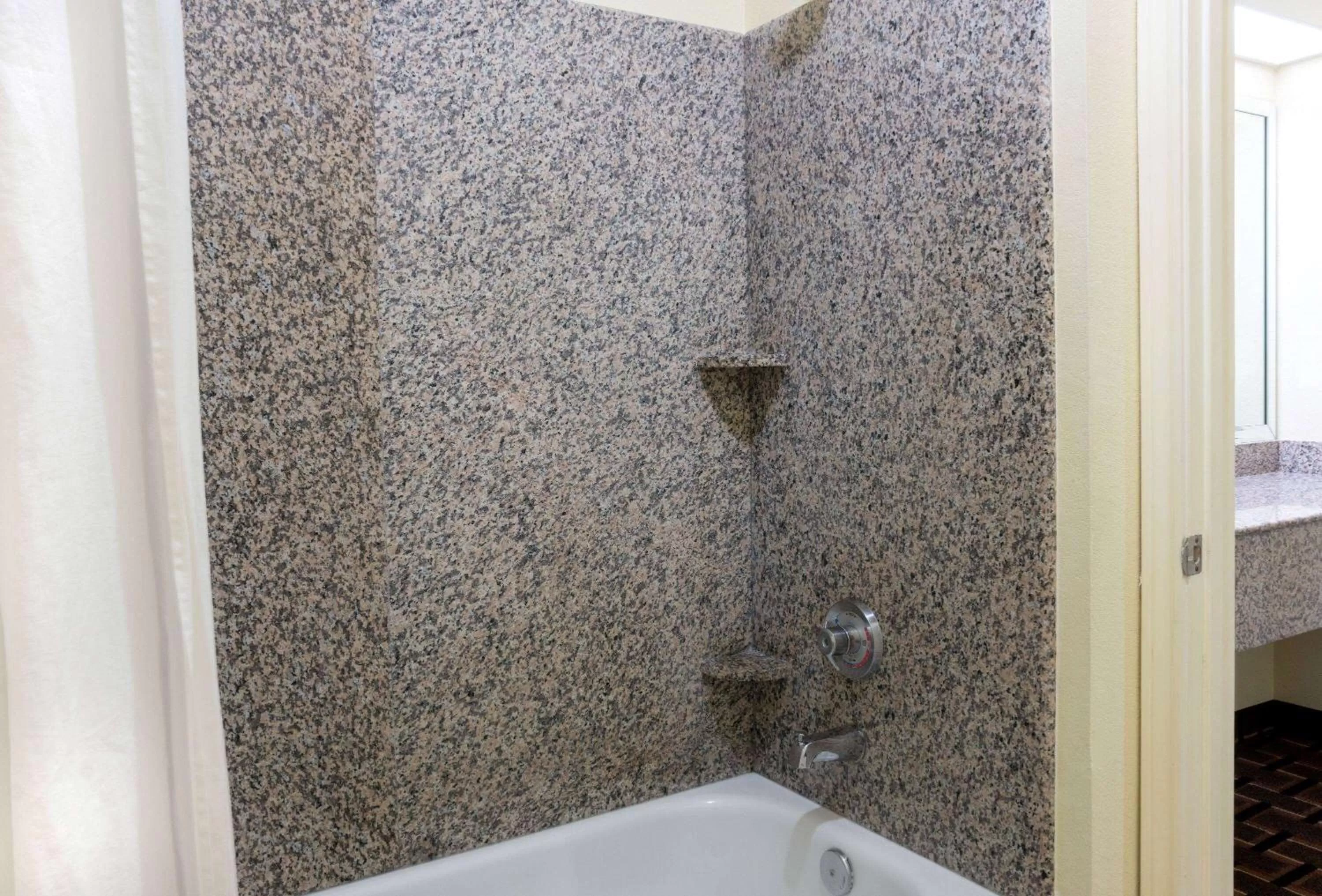 Bathroom in Super 8 by Wyndham Stafford Sugarland Area