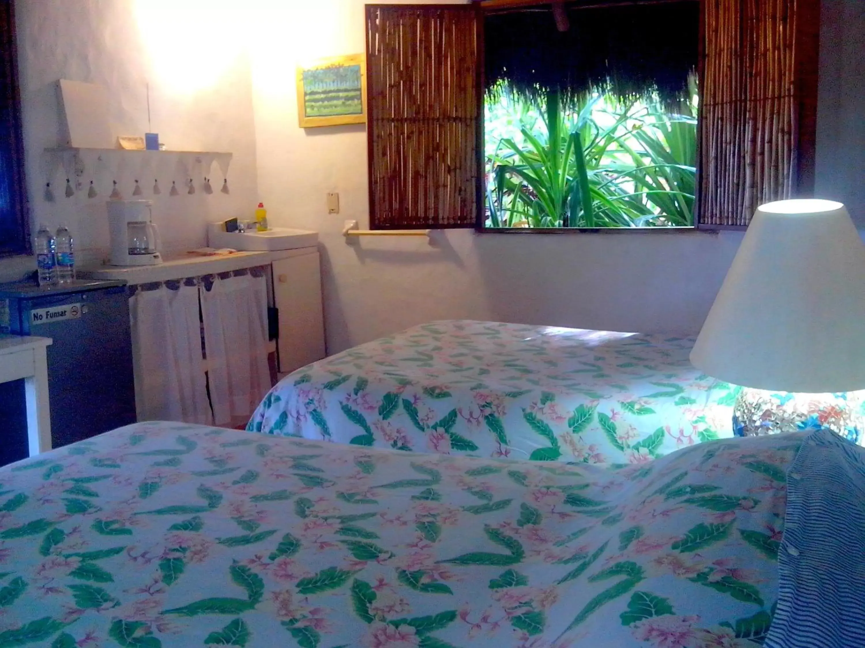 Bed in Junto al Rio Bungalows & Suites