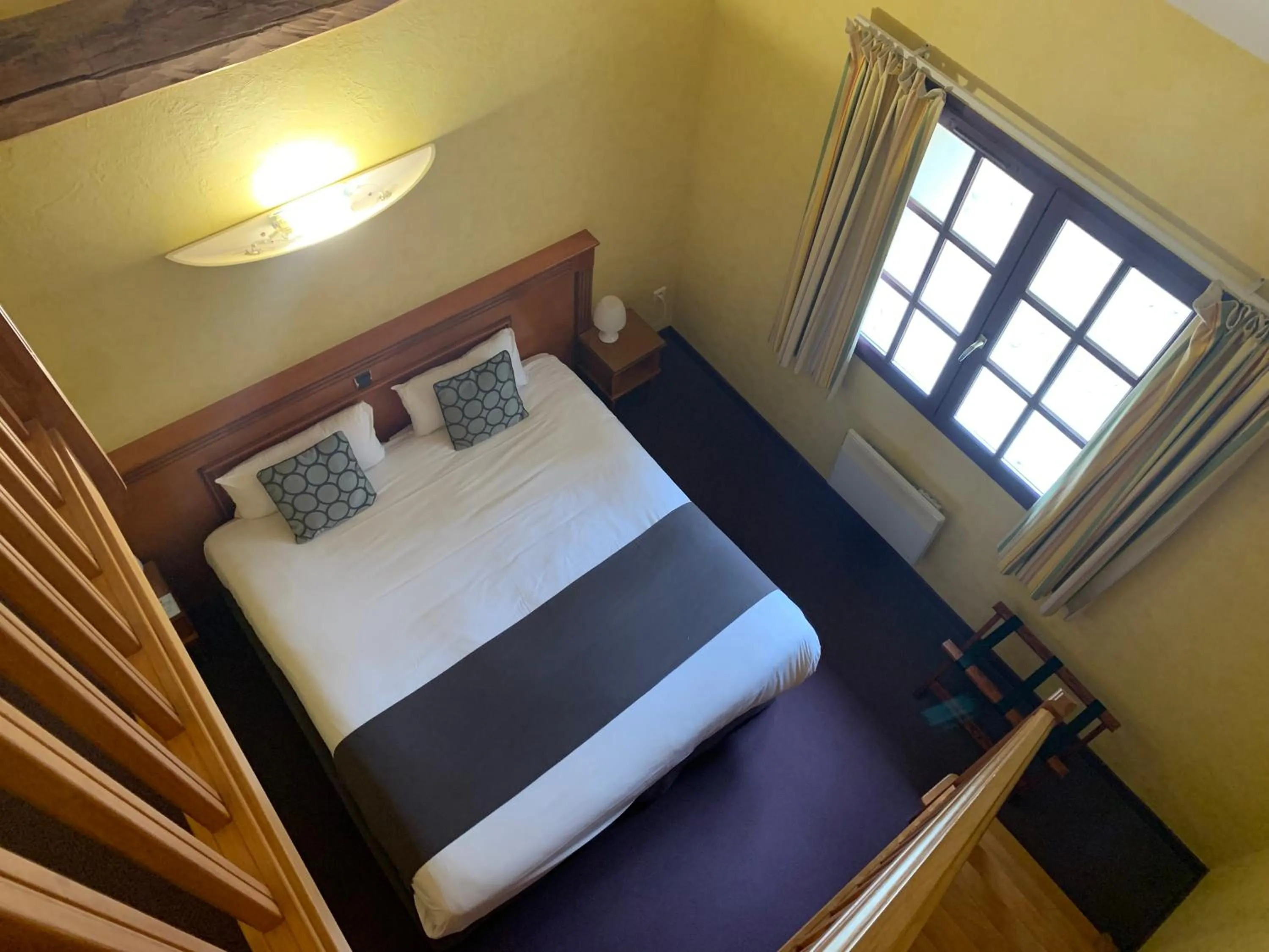 Bed in Logis Hôtel Restaurant Le Moulin de la Coudre