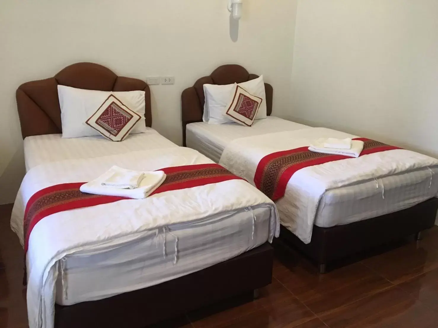 Bed in Hugpua Hotel