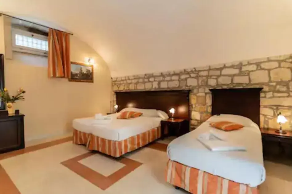 Bed in Palazzo Il Cavaliere B&B De Charme