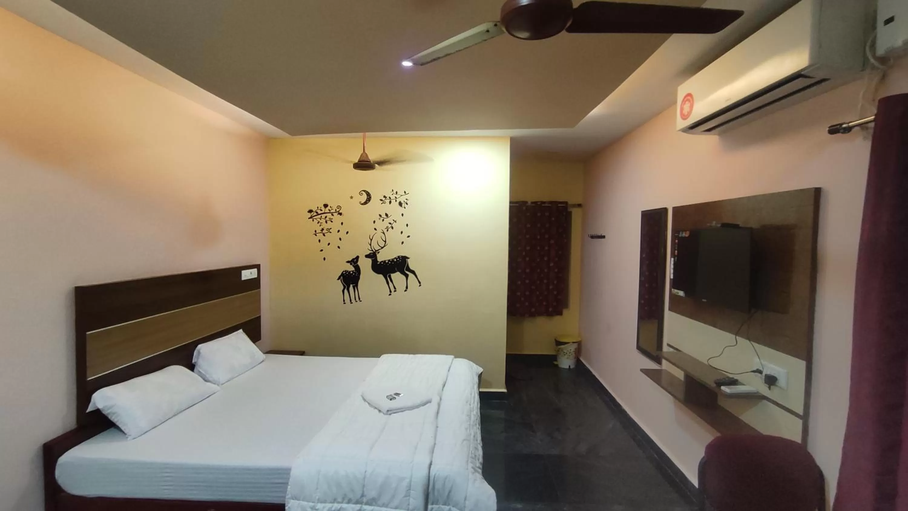 air conditioner, Bed in Sri Murugan Beach Paradise Hotel