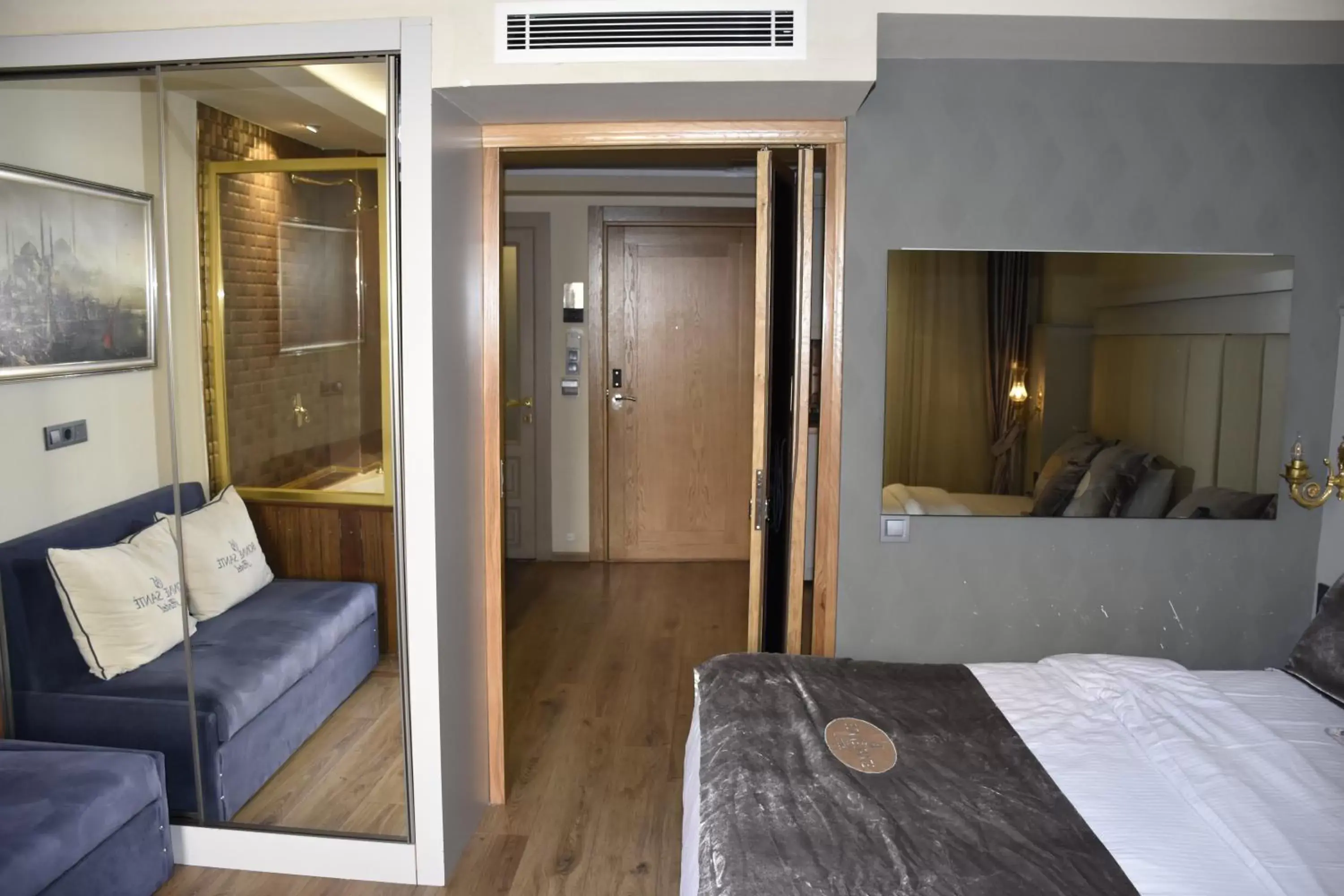 Communal lounge/ TV room, Bed in Bonne Sante Hotel