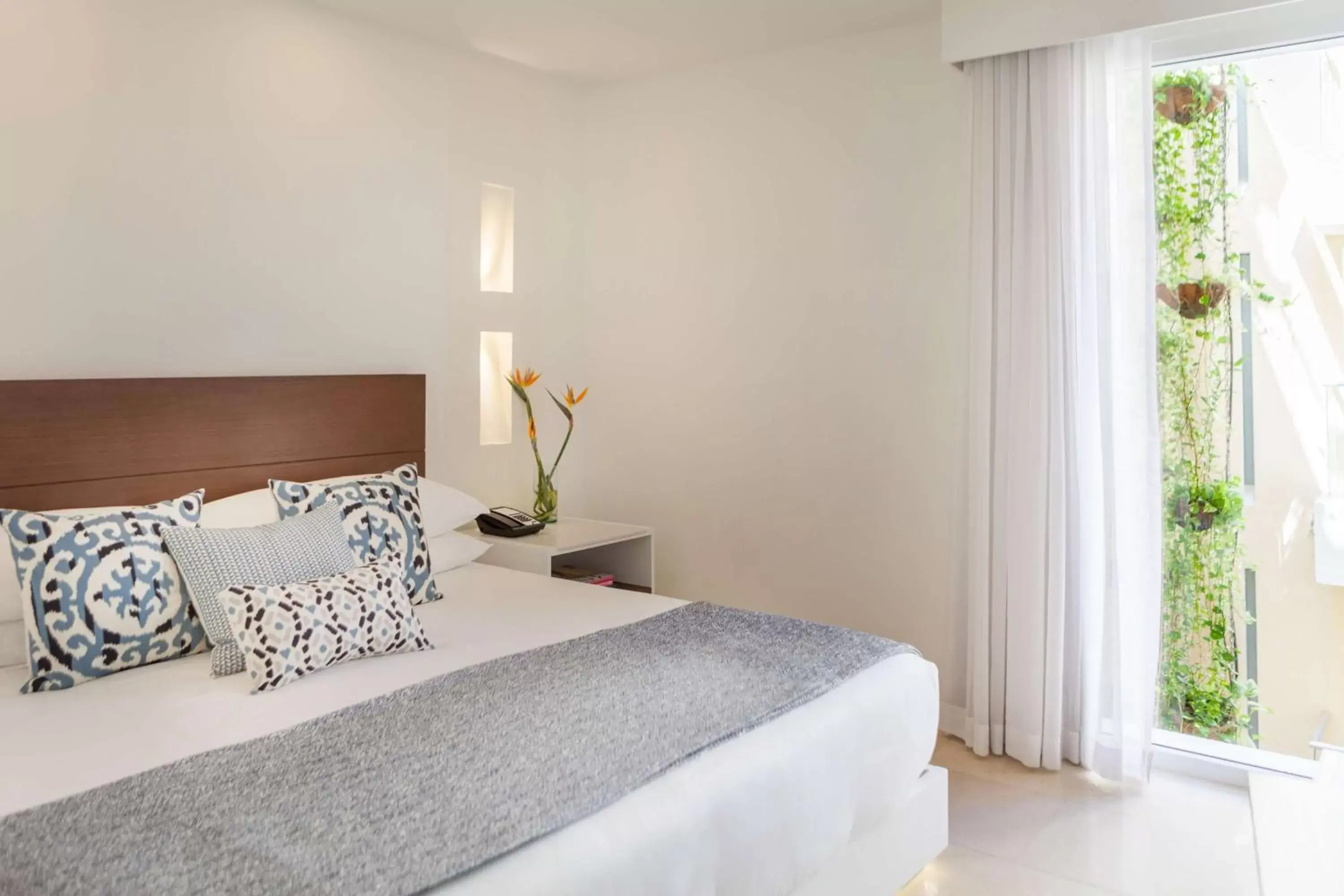 Bed in Nacar Hotel Cartagena, Curio Collection by Hilton