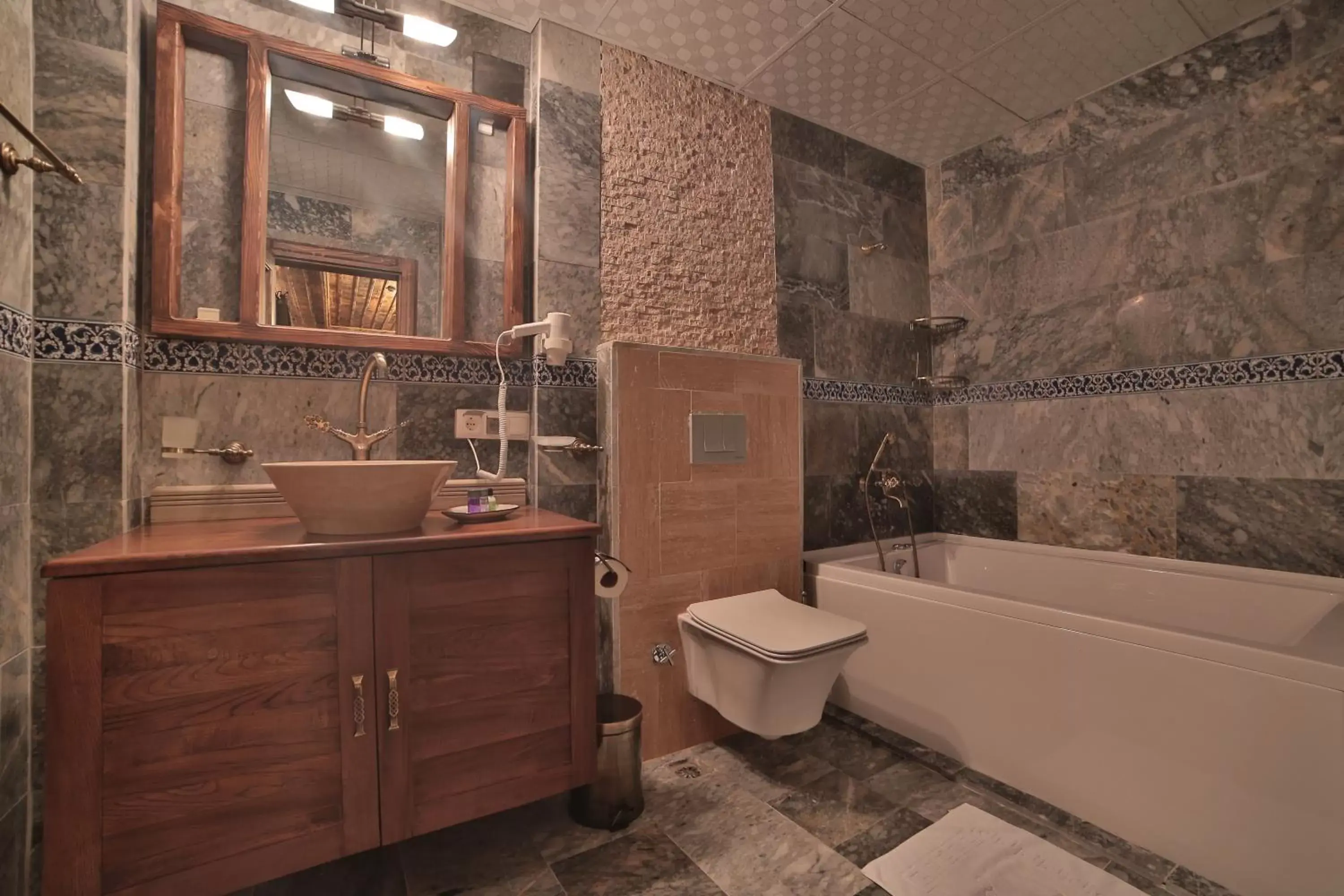 Toilet, Bathroom in Caravanserai Inn Hotel