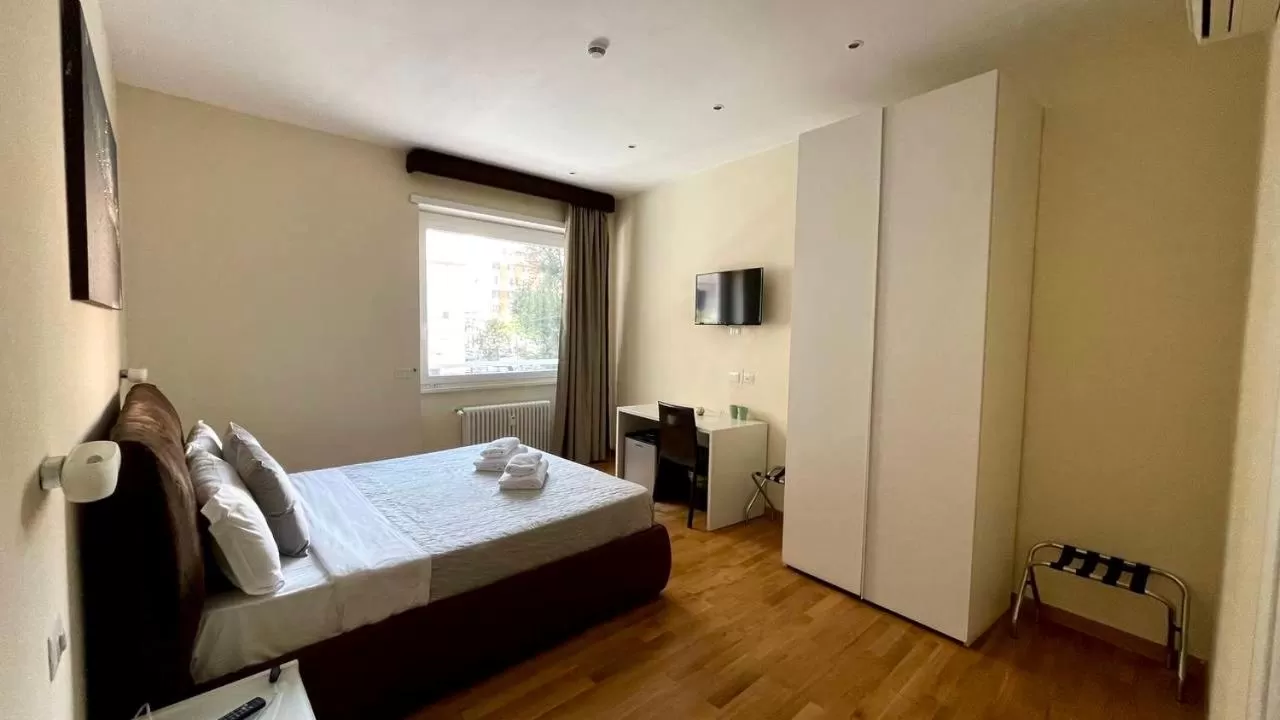 Bed in Rienzo Vatican Suites