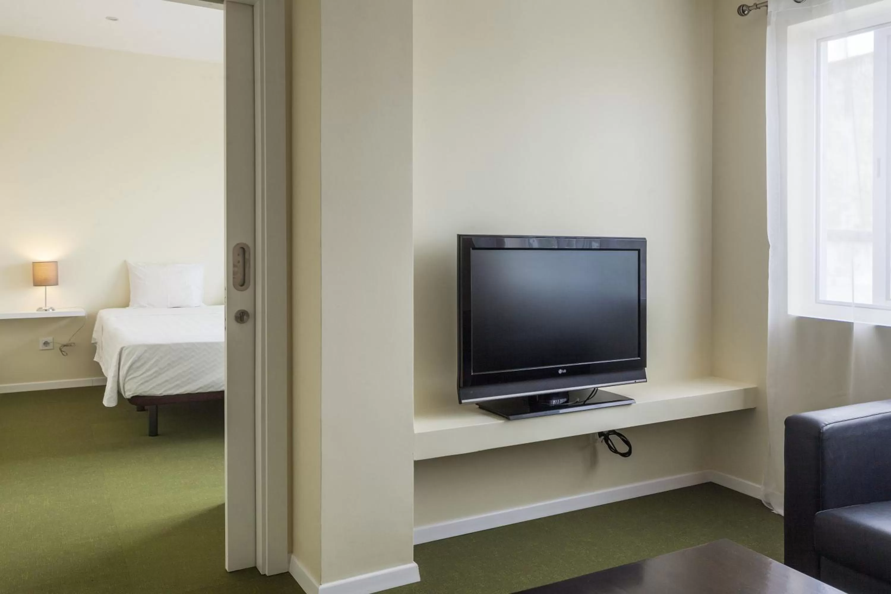 Communal lounge/ TV room, Bed in Hotel Sete Cidades