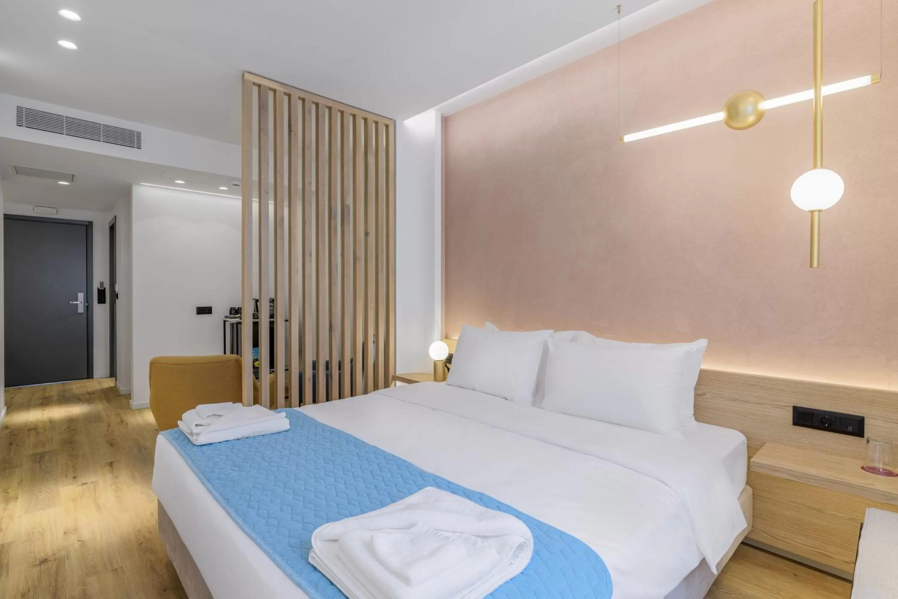 Bed in Acropolis Magenta Luxury Suites
