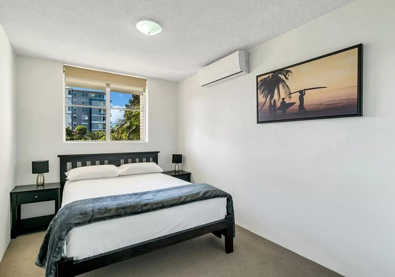 Bed in Tradewinds Apartments