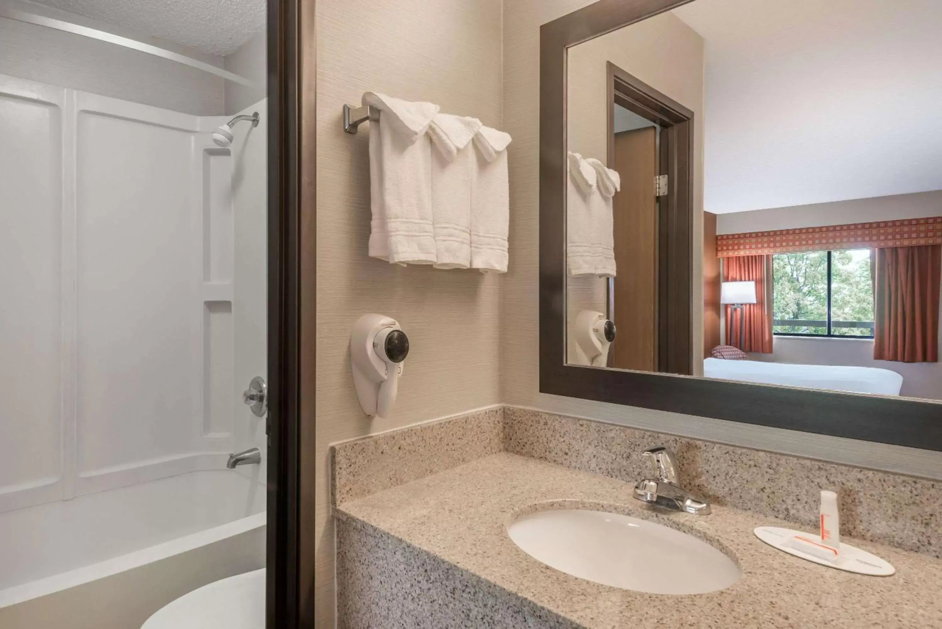 Bathroom in Days Inn by Wyndham Columbus Fairgrounds