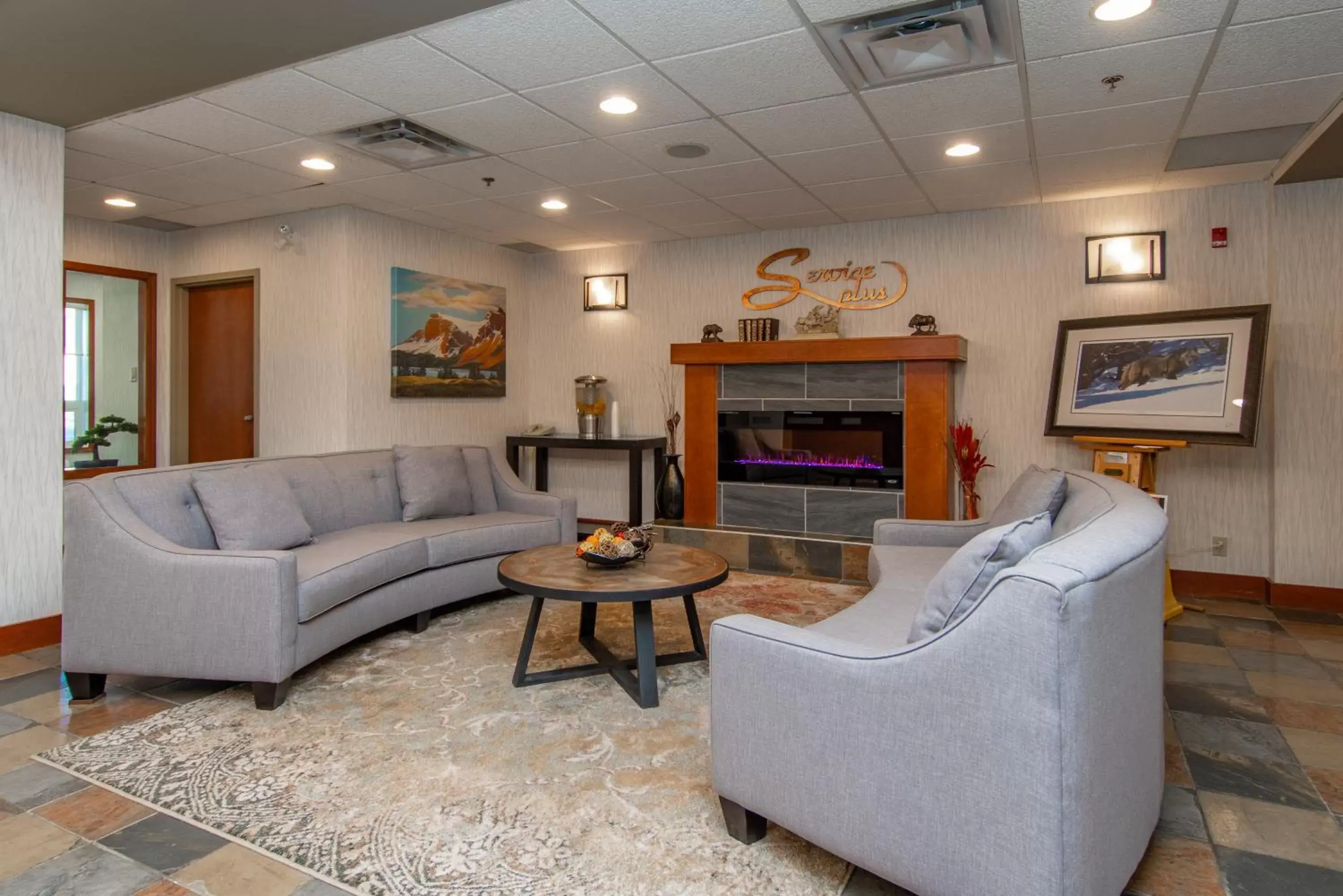 Lobby or reception, Seating Area in SureStay Plus by Best Western Calgary South East
