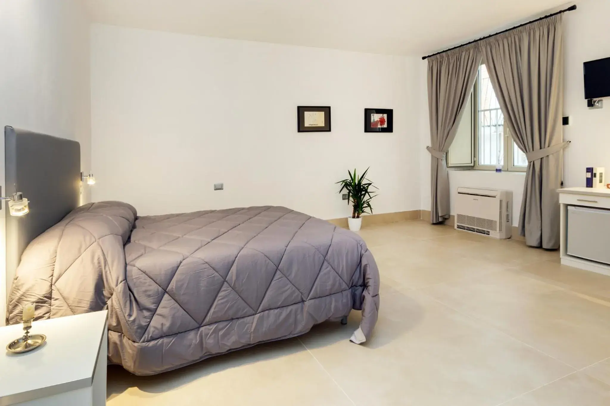 Bed in Il Tesoro Smart Suite & SPA