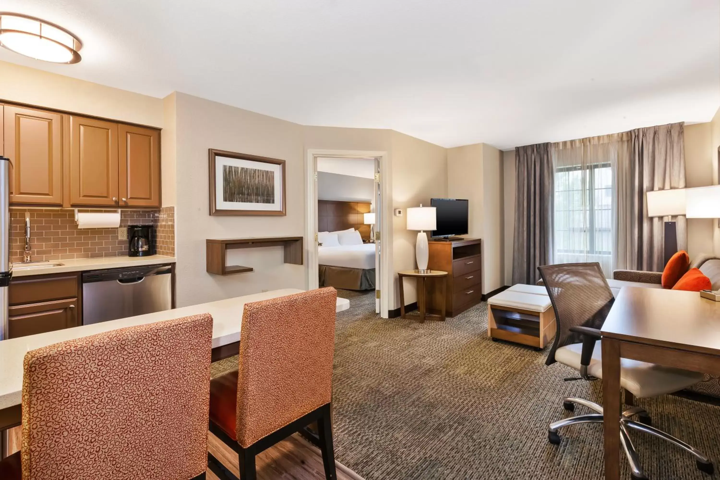 Living room, Seating Area in Staybridge Suites Kalamazoo, an IHG Hotel