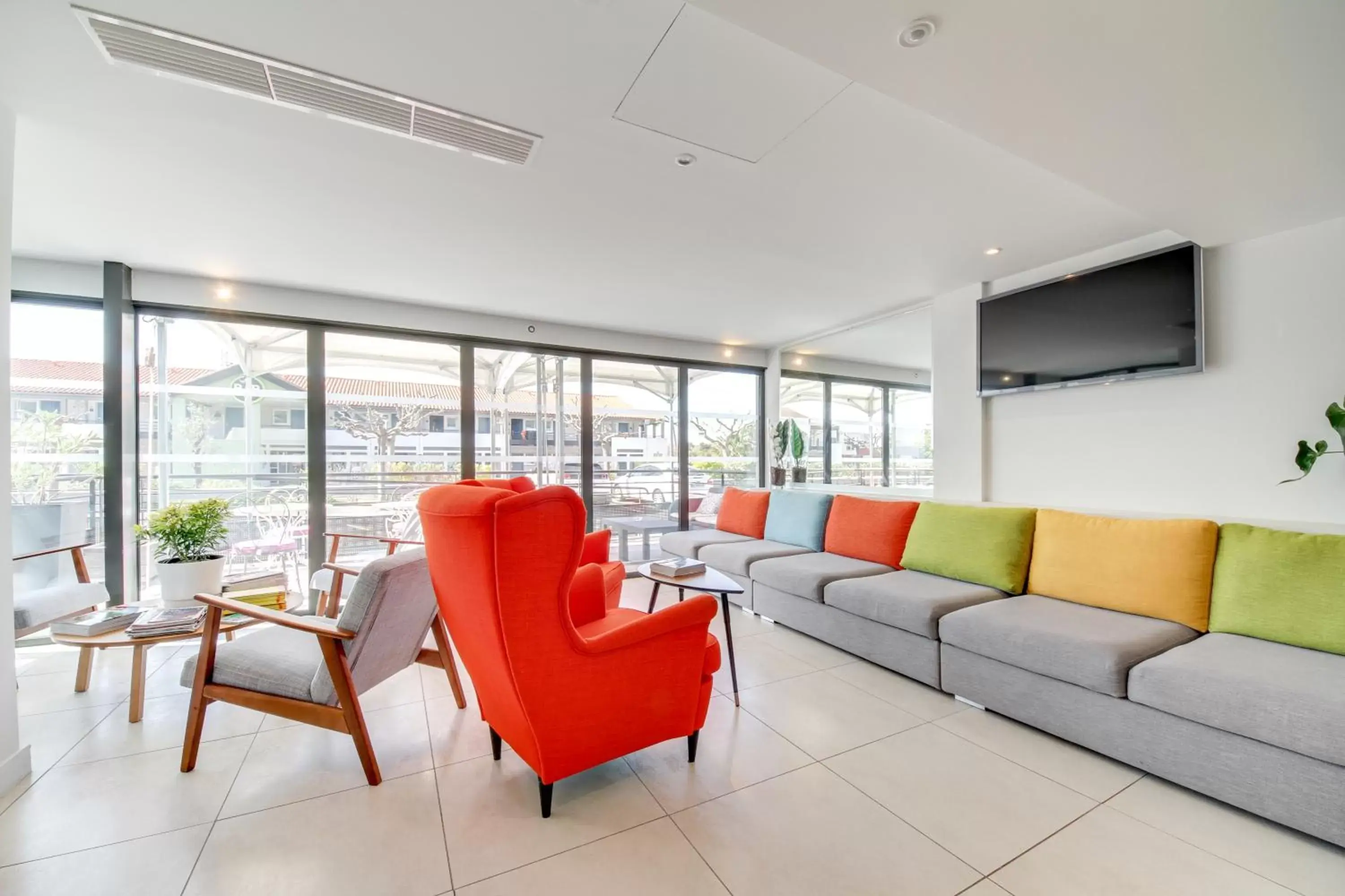 Communal lounge/ TV room, Seating Area in Brit Hotel Porte d'Espagne