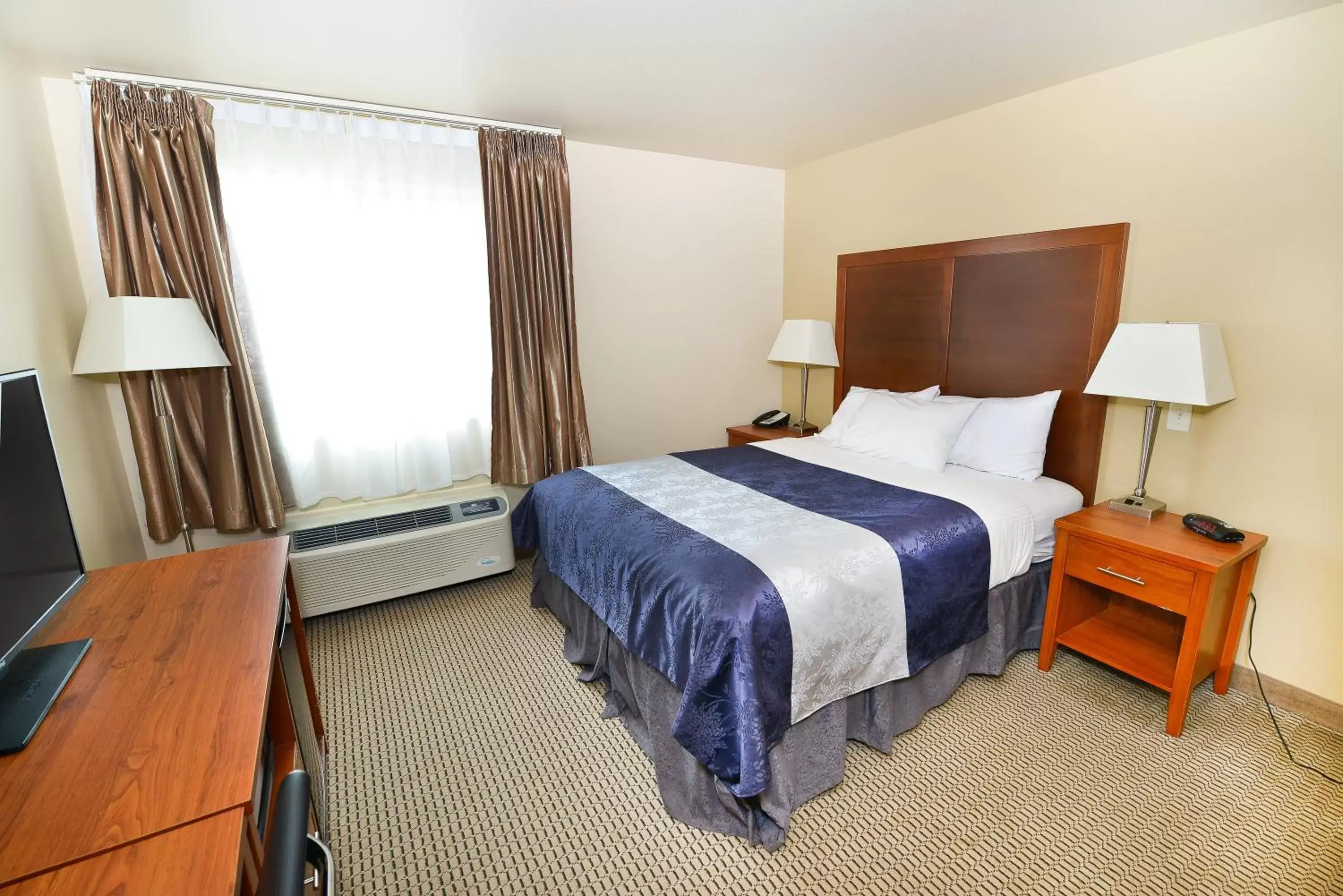 Bed in Baymont by Wyndham Grand Forks