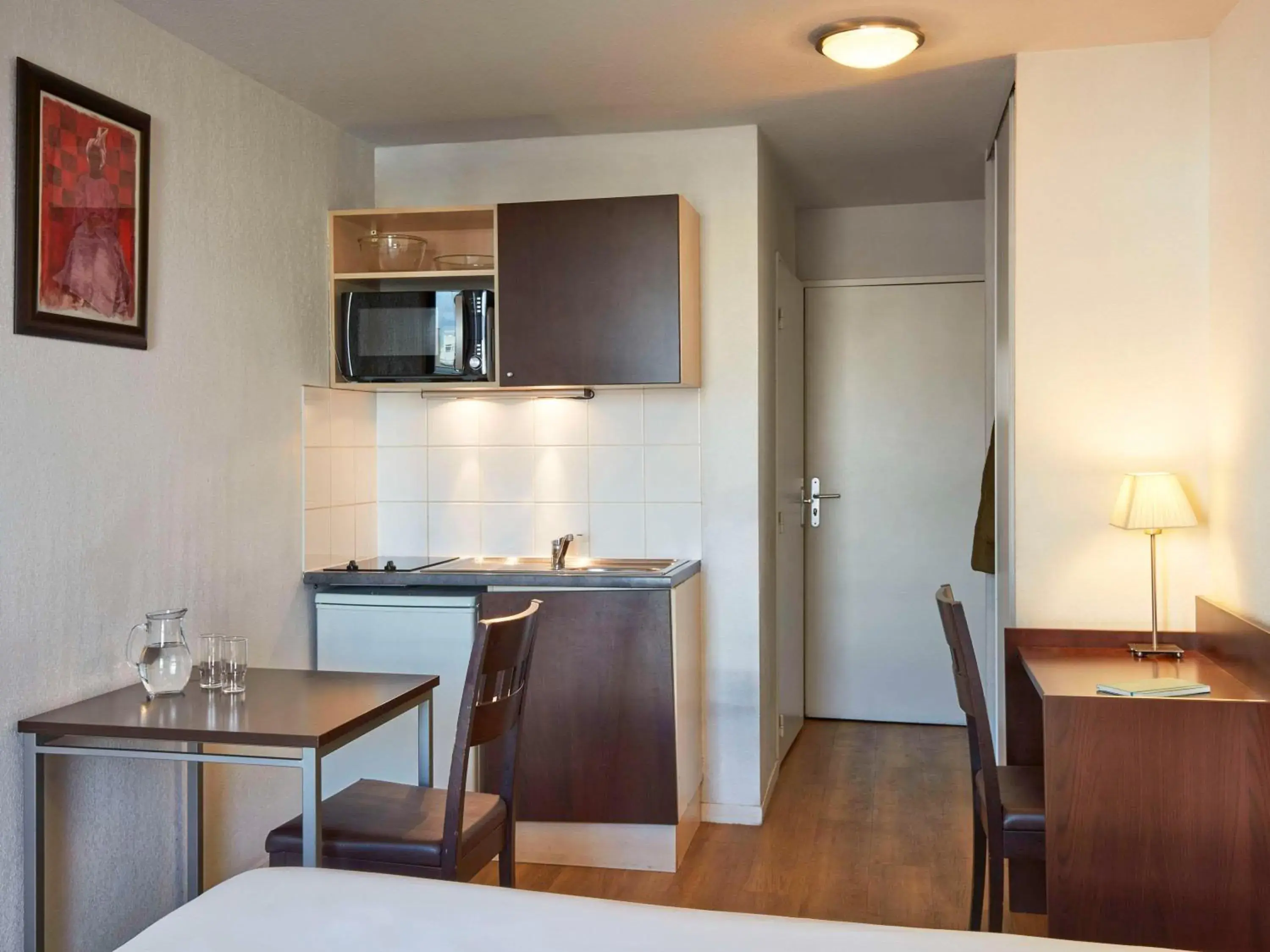 Bedroom, Kitchen/Kitchenette in Aparthotel Adagio Access Paris Saint-Denis Pleyel