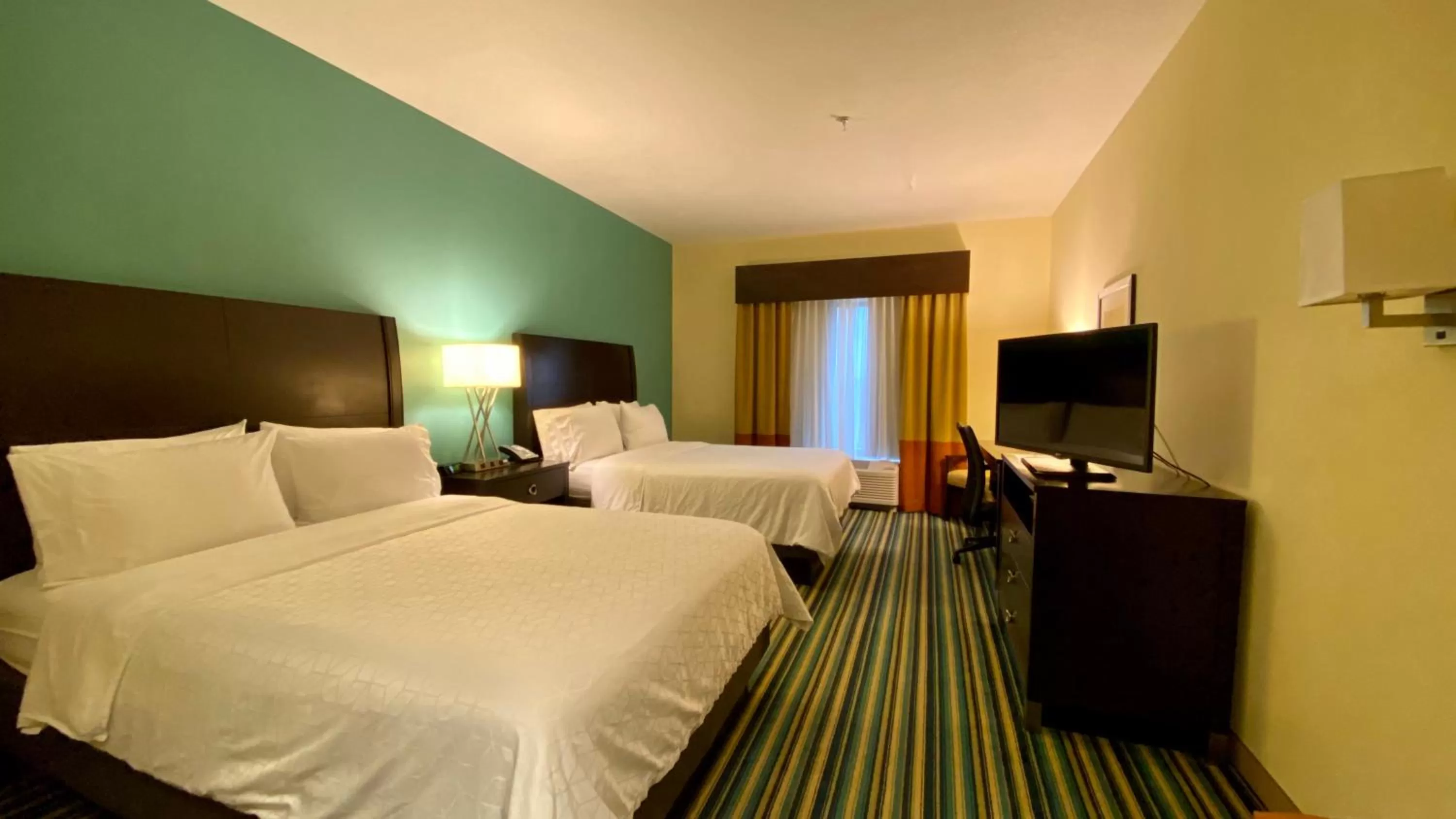 Photo of the whole room, Bed in Holiday Inn Express Hotel & Suites Orlando East-UCF Area by IHG